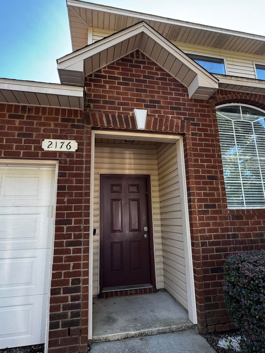 Welcome to this beautifully maintained, contemporary townhome located in the heart of Navarre. Just a short, 4-mile commute to the sugar-white sands of Navarre Beach, this 2-story gem offers the perfect blend of style, convenience, and low-maintenance living.  Inside, you'll find a modern kitchen featuring stunning granite countertops, stainless steel appliances, and an open layout ideal for entertaining. The main living areas boast durable, easy-to-clean flooring, while cozy carpet is reserved for the bedrooms and staircase for added comfort. The primary suite is conveniently located on the main floor, providing added privacy and separation from the additional bedrooms upstairs -- ideal for families, guests, or home office needs. Enjoy the ease of direct-entry from your attached 1-car garage, and let the HOA handle all lawn care so you can focus on enjoying life along the Gulf Coast. Whether you're looking for a full-time residence, vacation getaway, or investment opportunity, this stylish townhome is move-in ready and sure to impress!