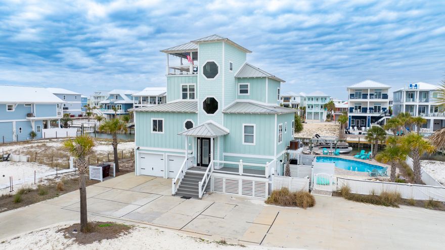 Coming Soon Canal-front living on Navarre Beach! This beautifully updated 4-bedroom, 3.5-bath home offers the perfect blend of comfort, views, and outdoor lifestyle. Enjoy your private heated and cooled saltwater pool, along with a dock and boat lift, making it easy to spend your days on the water. Designed for relaxed coastal living, the home features fresh interior and exterior paint, a remodeled kitchen, and new flooring throughout. A separate living qtrs. offers an efficiency kitchen, provides great space for family, guests, or additional privacy. Outdoor spaces truly shine here. A large rooftop covered deck offers stunning views of both the Gulf and the Sound, creating the perfect setting for sunsets, entertaining, or simply relaxing in the coastal breeze. Ideally located just steps from the Gulf and beach access, this property offers the best of Navarre Beach living--boating, swimming, and beach days all within easy reach. A rare opportunity to own a canal-front home with incredible views, updated features, and exceptional outdoor amenities.