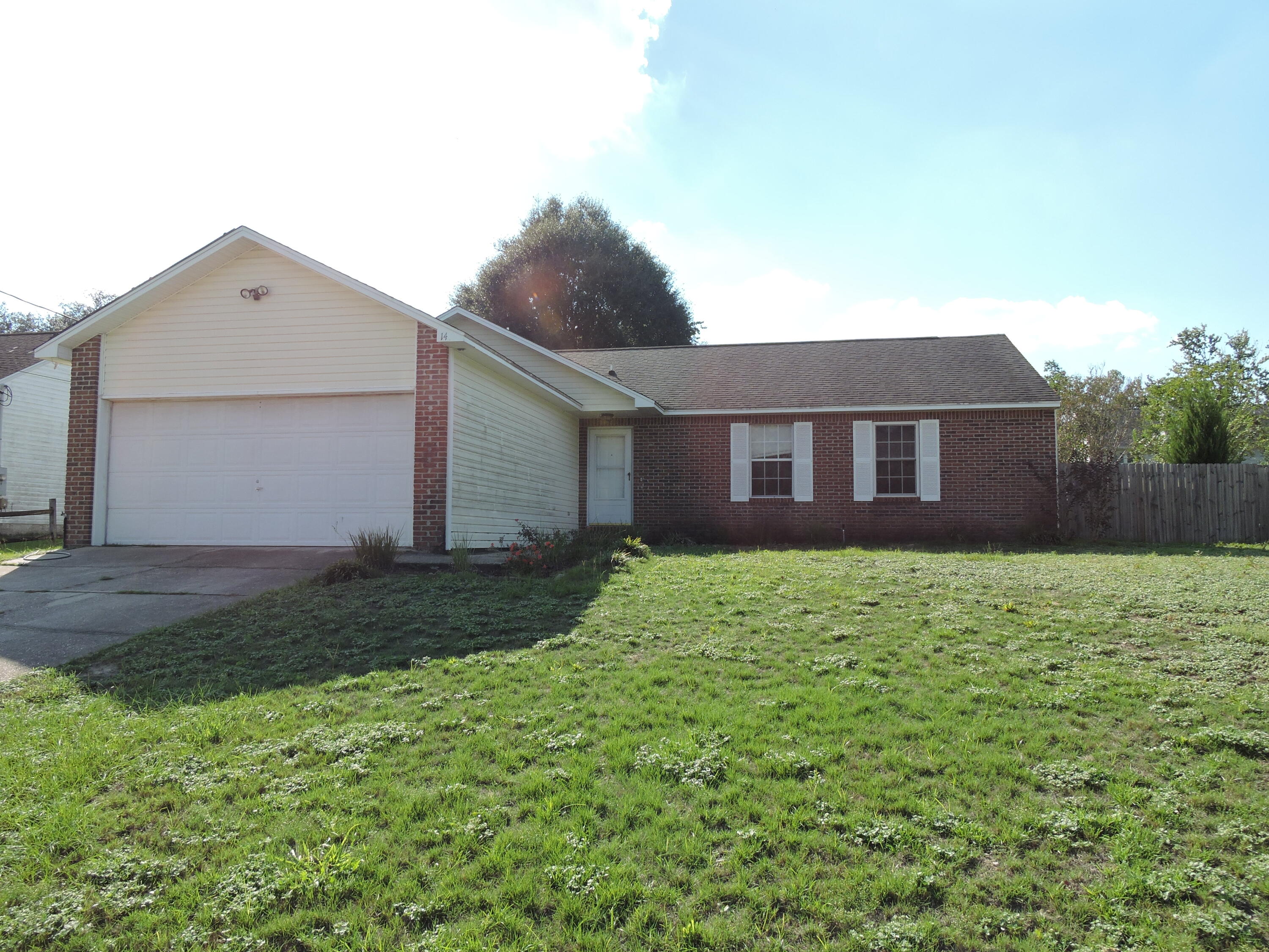 Available NOW! Conveniently located in the Park Place neighborhood behind Walmart and close to the I-10 exit in South Crestview. The home features a large open concept kitchen/living dining area with cathedral ceilings and accented in a wood burning fireplace. The kitchen ample cabinet space painted in gray with tiled countertops and backsplash and accented with black appliances to include french door refrigerator and smooth top stove. The master is large featuring LVP flooring, walk in closet and separate dressing and shower area. The additional bedrooms are nice sized with ample closet space. The backyard is fenced and pets are welcome (restructions apply). The home features solar panels to keep your cooling costs lower in the summer months. Schedule your showing today!