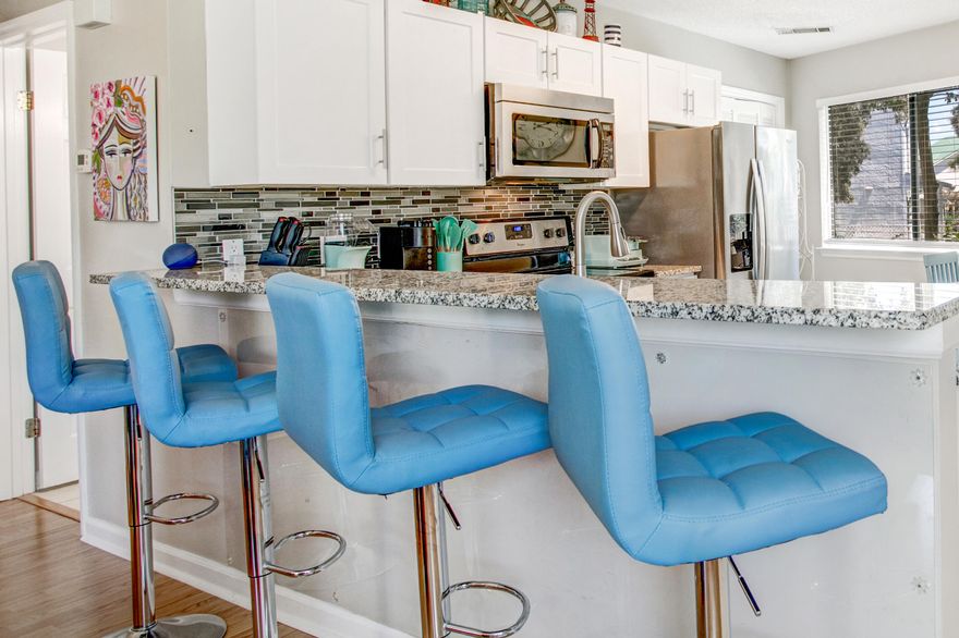 Prime Beachside Living! Motivated seller relocating—great investment or owner-occupied opportunity!

Just 2.5 blocks from the sugar-white sands and emerald Gulf waters, this 2-bed, 2-bath ground-floor condo offers 944 sq. ft. of breezy coastal living. Its unique octagon floor plan creates an open, light-filled feel. The fully stocked kitchen boasts stainless steel appliances, granite countertops, and a modern backsplash. Upgraded bathrooms feature quartz countertops for a touch of elegance. Recent updates: new roof, AC (2020), water heater (2022), and modern ceiling fans. Tile flooring in kitchen/baths and durable LVP throughout make maintenance easy. Enjoy two pools, one of heated for year-round fun., Sold fully furnished and priced to sell before peak season—own your slice of paradise