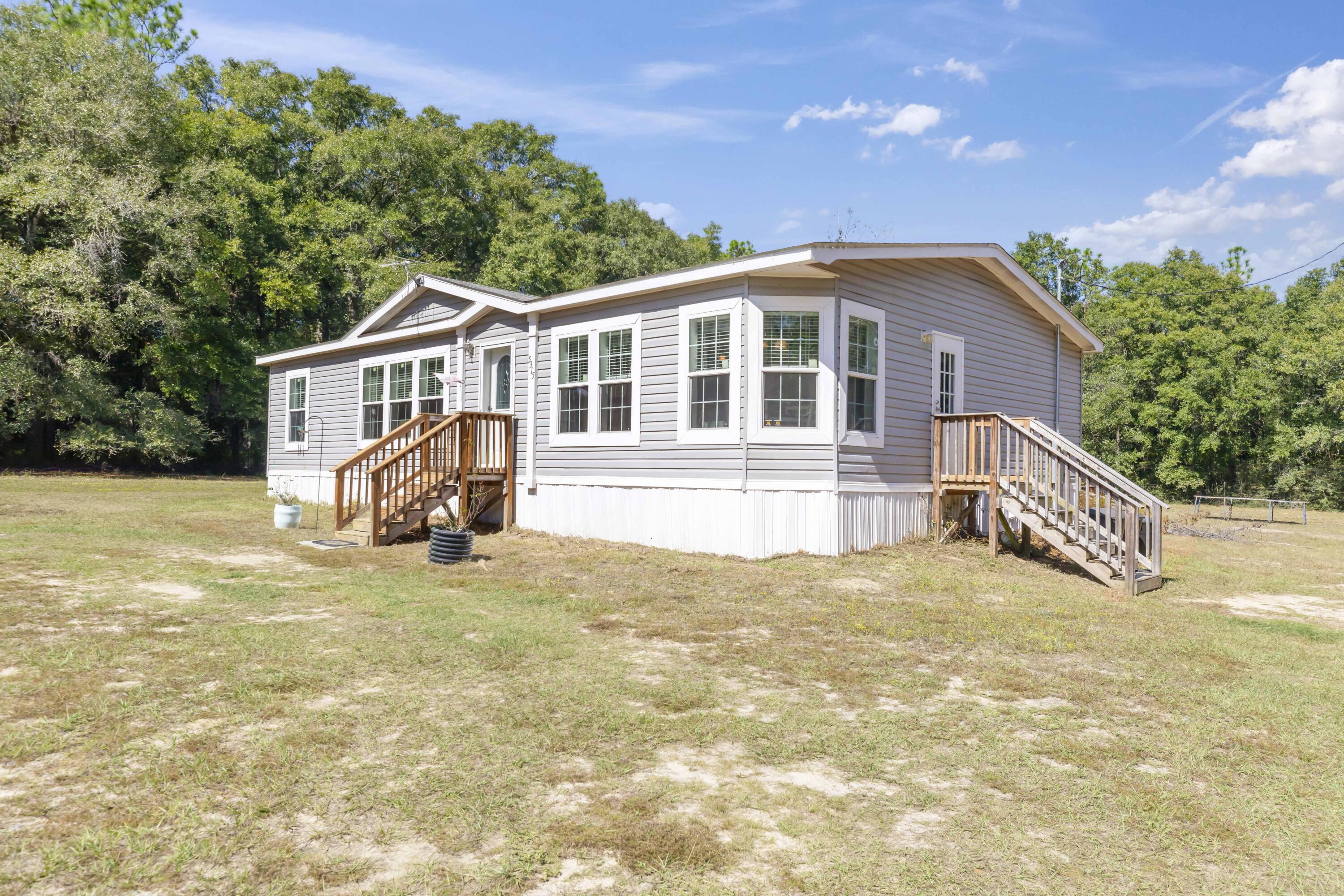 This Country Charmer is ready for you to call it home! It offers both convenience and privacy in the sought-after Baker community. The home features lots of natural light, split bedroom, and open kitchen and living area. You're sure to love the spacious primary bedroom and garden tub in the primary bath. The yard outside is a clean slate for you to plant a garden, build a fire pit, and to make it your own little country escape. Call today to view this gem. Buyer to verify all information deemed important.