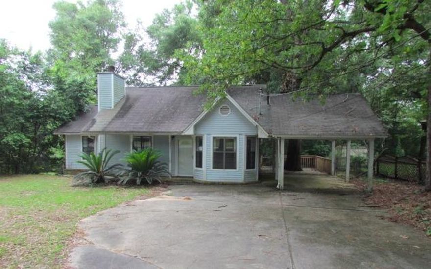 Cottage style house in Crestview with a huge price reduction, REO oppportunity! When you enter the house, there is a quaint dining area off to your right that looks out onto the front yard, then the adjoining kitchen with a pass through window to the living room. The living room has a nice wood beam and looks out over the large front yard and has a fireplace to include vaulted ceilings. The master bedroom has a step down bonus room that would be ideal for an office and is a good size. The back porch is screened in and looks over the park like setting. Property being sold 'as is'. Buyer to verify all pertinent information as to satisfy themselves.