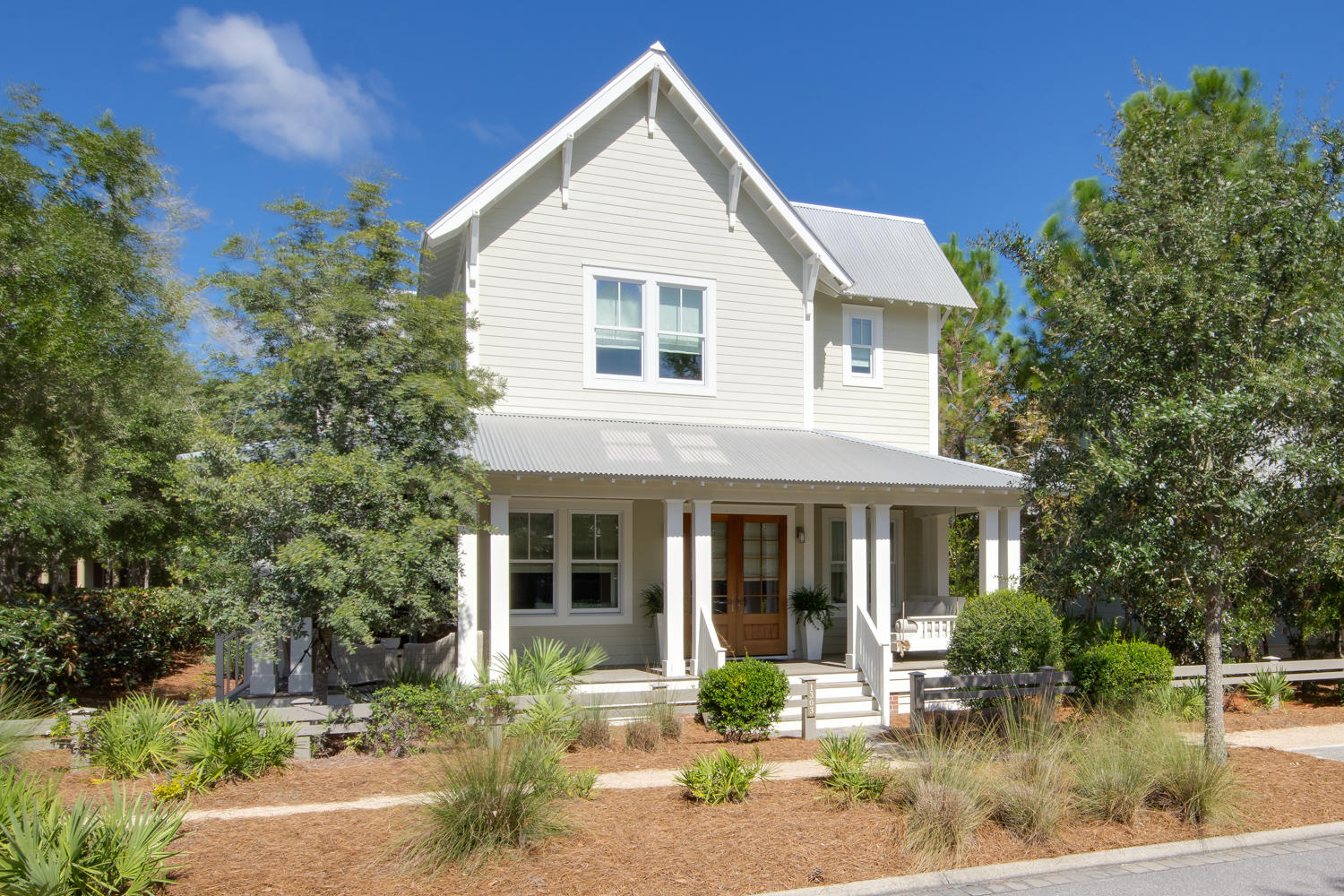 Find classic coastal style in this bright and airy WaterColor residence with a 4 BR/4.5 BA main home, a 1 BR/1 BA private-entry carriage house and a gorgeous outdoor living area with a covered summer kitchen and a plunge pool. The first story features a comfortable open-concept design with reclaimed white oak floors and striking reclaimed wood ceilings. The fully-equipped kitchen offers commercial grade appliances, a large center island and Alabama White marble counters. A spacious office flanked by French doors and an exquisite master suite are also located on the first level. The second story includes an additional master suite along with two guest suites, each with a private bathroom and walk-in closet. A cozy carriage home rests atop a two-car garage providing the perfect