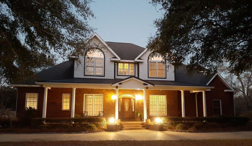 Check out this traditional Southern Oasis sitting on approx 2 acres!! This stunning 5 Bedroom 3 & 1/2 bath home overlooks a beautiful crystal clear private Spring fed Pond with access to a second one as well. The 1st Floor Master Suite & updated Bath has a Whirlpool Tub, Seperate Shower and His/ Her Closets. Open Living Space with impressive floor to ceiling Stone Fireplace. The Upstairs has 4 Bedrooms and 2 Full Bathrooms. The Kitchen has beautiful Granite Counter Tops, Double Ovens, and lots of Custom made Cherry Cabinets.  This home sits high on a hill with a huge Covered Back Porch and Deck that overlooks the pond and dock area, and this home has plenty of storage. Too many details to list, check out the photos or request your own private tour. See it today!!