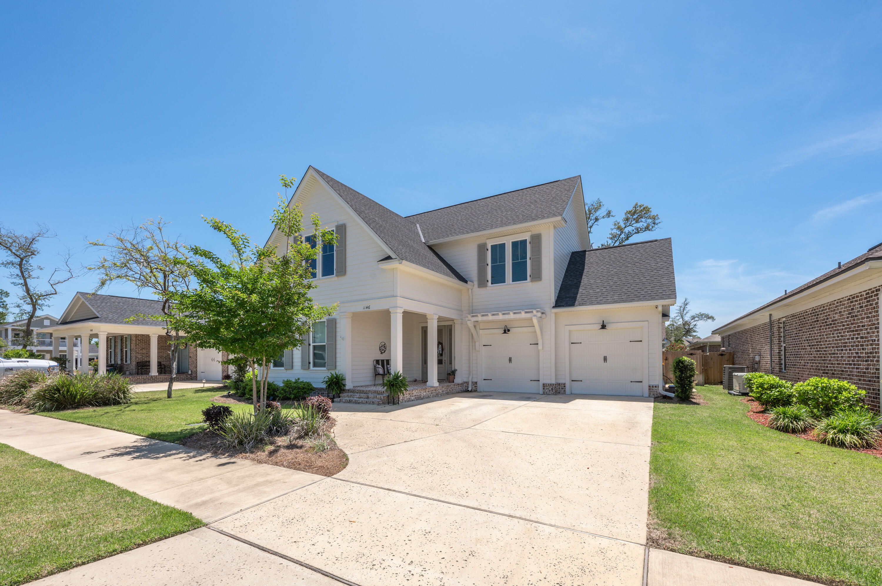 This 4 bedroom 3.5 bath Deer Moss Creek home was built by Huff Construction in 2019. The interior design has 8 foot doors, crown molding in the main living areas, LVP flooring throughout with carpet only in the guest bedrooms, recessed lighting, and the owners had the living room wall updated with shiplap. The Kitchen has white shaker soft close cabinets, with luxury quarts countertops, stainless appliances, to include a gas stove, under cabinet lighting, and a walk in pantry. The master bathroom has tile flooring with a spacious walk in tile shower with glass surround, the master closet is a 10x10 walk in closet. The guest bathrooms have white shaker cabinets with quartz tops and tile showers. The laundry room has its own sink and vanity. The back porch is screened in and includes a