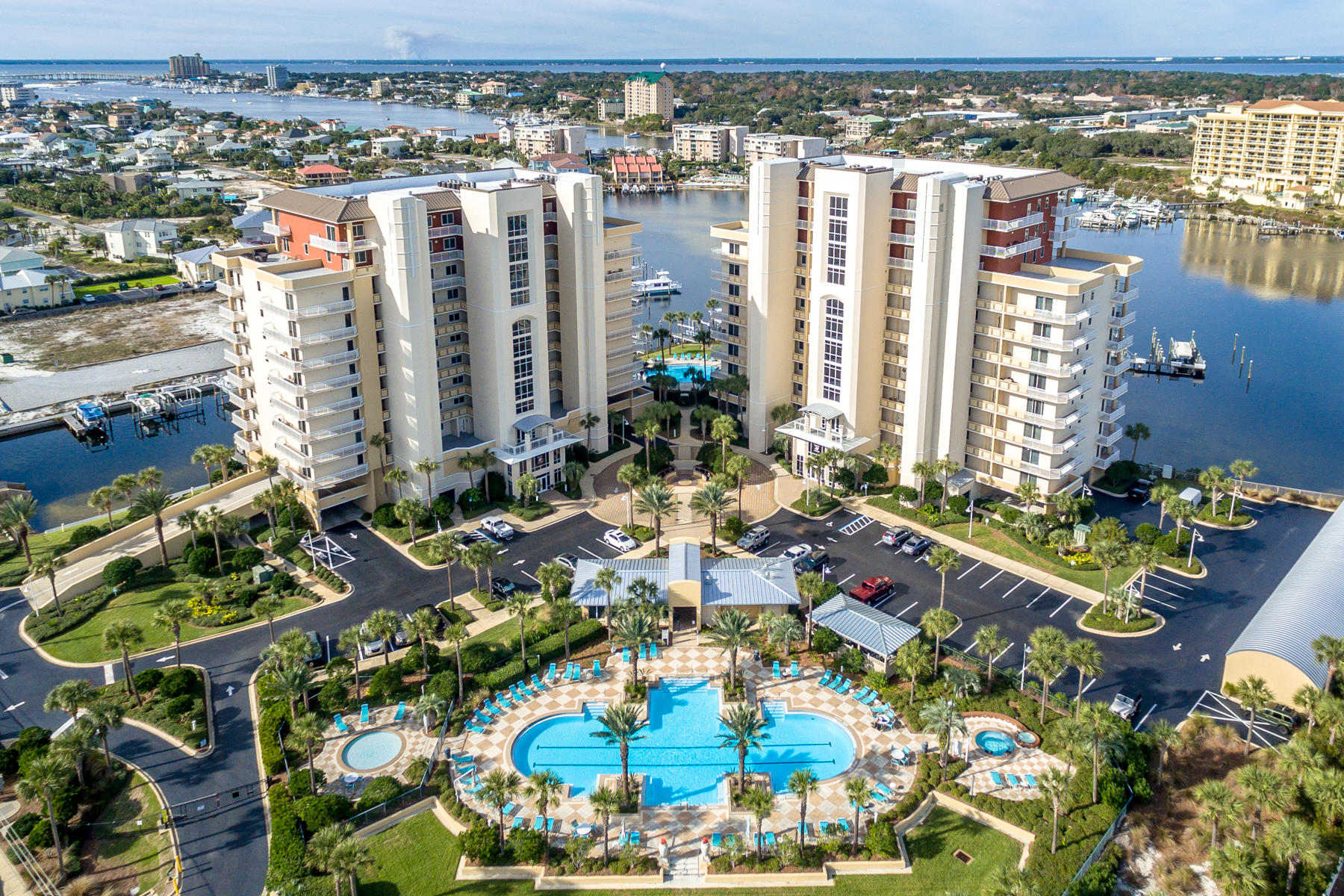 Harbor Landing 902A is THE penthouse condo for beach lovers and boaters alike with beautiful expansive gulf and harbor views plus a large detached garage and much coveted deep water private boat slip. This 9th floor condo offers the best of what Destin and the Emerald Coast have to offer with direct access to boating in the harbor and beach access a quick walk away. You can do it all without ever getting in a car! The condo impresses all who enter with a wide entry way leading to a huge great room lined with windows overlooking the harbor. The well equipped kitchen is an entertainer's dream with a large island, granite counters and stainless steel appliances. The two master suites both overlook the harbor.