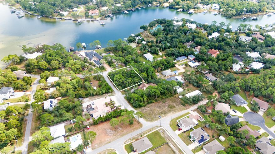 ** Rare Opportunity of Land in Santa Rosa Beach, across from Bayou, Potential Water view**Build your dream home on this large 1/3 acre wooded corner lot just across from Hewett Bayou with potential Waterview, deeded water access, and the freedom of no HOA and no build-out time!!  This prime corner location homesite offers peaceful surroundings in an established beautiful waterfront neighborhood, all within a few minutes drive to endless shopping, dining options, local hospital, multiple state parks, and the sugar sand beaches of 30A.  Looking for build ideas? We have established builders with ready to build site plans ready to bring your vision to life. Make your dream of living by the beach come true. Call today.