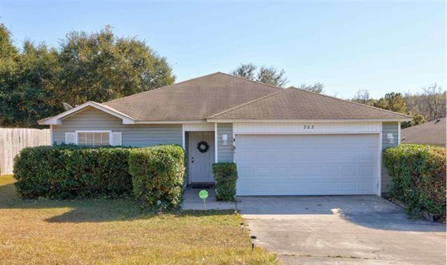 3BR/2BA home w/ 2 car garage, newly refinished back deck, open living room/kitchen area, split bedroom plan, and mature landscaping. New roof to be put on after closing.