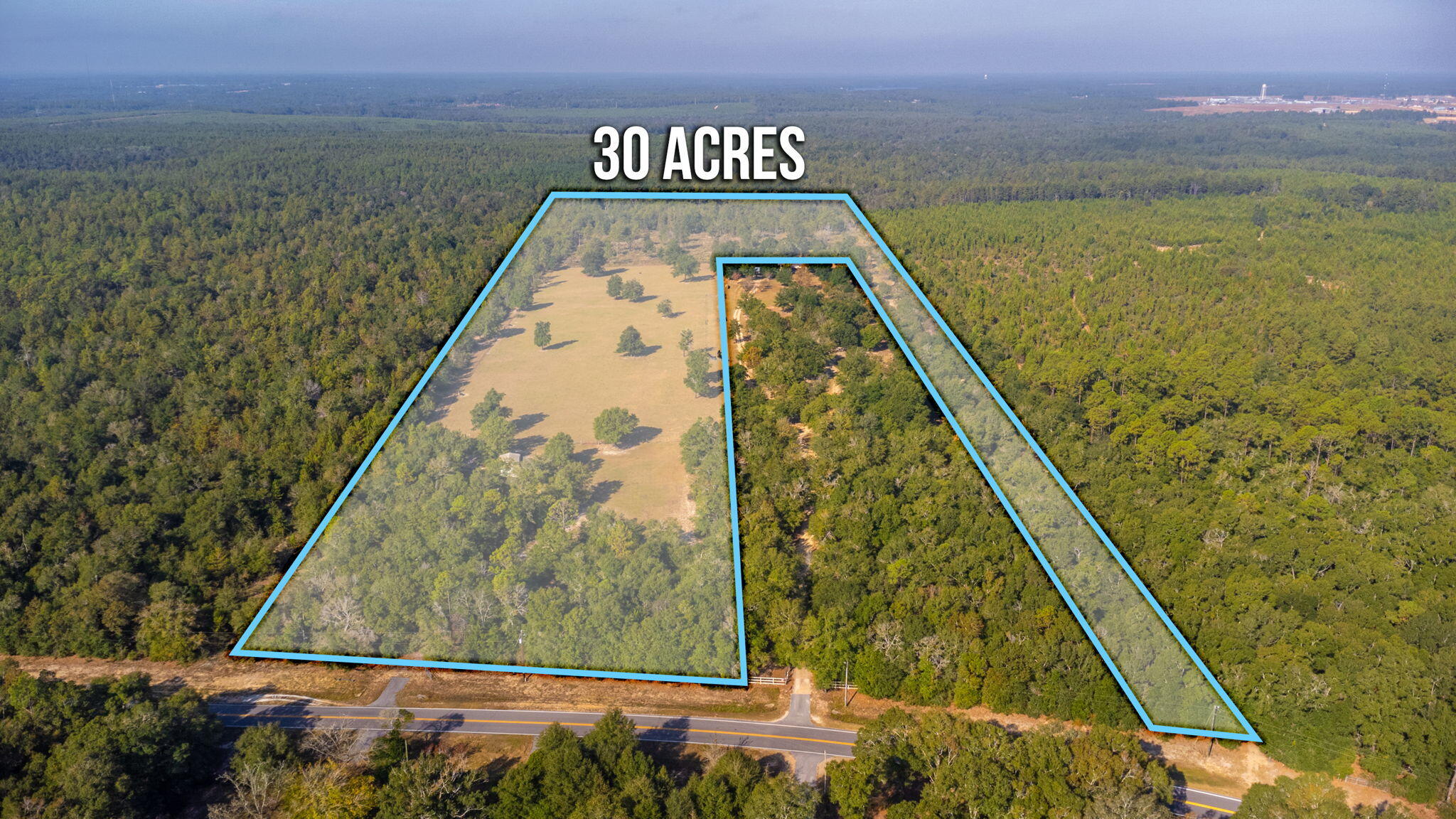 If you are looking for acreage in North Walton County, THIS IS IT!! Even if you haven't been looking for acreage in North Walton County, I bet you are now, because again, THIS IS IT!! You will love the rolling hills and turns on the scenic drive in. All of the ground work has been laid with a large portion already being cleared. The front 3 acres is partially cleared with an inviting gravel driveway & metal pole barn with concrete foundation and a large garage roll-up door with a lean-to off of the side. Pole barn is completely closed in with metal sides and roof. There is power run to the pole barn and also a private water well that is used for the livestock watering system. The middle portion of the property is approximately 7.5 acres of pastureland that is cross fenced and currently used for cattle, however, it would be a beautiful home site with that part of the land probably being the highest in elevation and providing a wonderful view of the rest of the land. Making your way to the back 18.5 acres you will notice that the property was bush hogged a few years back. There was a pond on the very back side/west property line that had the dam break and no longer fills and holds water however there is still a small stream that runs through that side of the property that flows more frequently, the more rain we get. Due to this, as expected, a very small portion on the back side is in flood zone A according to Walton County Property Appraiser map, however the rest of the acreage is high and dry. Whether you are looking for a new home site or land to raise your cattle, this property will not disappoint you. Schedule your showing! Appointment is required before you can walk property.