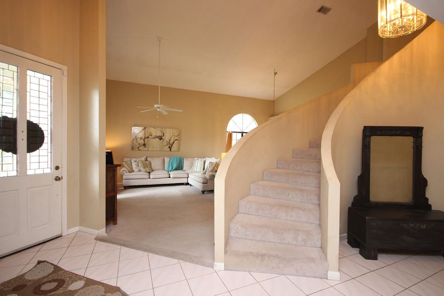 Beautiful home in the prestigious and highly sought after Windward gated community. This four bedroom three bath home provides easy living for the family who wants ample space for entertaining and enjoying the family. The great room boast vaulted ceilings and a wood burning fire place. A guest bedroom and full bath are downstairs with the other three bedrooms and two baths upstairs. The kitchen has been newly remodeled with concrete counter tops and a stunning back splash. Off the kitchen and additional family room is a beautiful back deck with a huge back yard. To top it all off, this home is only one block from the community private beach!This property is truly a must see!