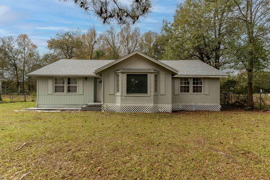 Welcome Home to this 3 bed 2 bath cottage nestled in the heart of historic Century Florida!  This remodeled beauty sits on just under a half acre lot with a 12 X 22 detached garage.  Step inside to beautiful wood look LVP flooring, new interior paint, fixtures and a gorgeous kitchen featuring breakfast bar and large farm sink!  Enjoy your morning beverage on the back screened porch.  All of this right next door to Showalter Park!  The historic town of Century borders the Escambia River and is home to 130 acres of fresh water known as Lake Stone, a fisherman's paradise!  Don't miss this one!  HVAC replaced in 2020, Roof replaced 2023.  Buyer to verify all items of importance including measurements and school zones.  Home being sold As Is.