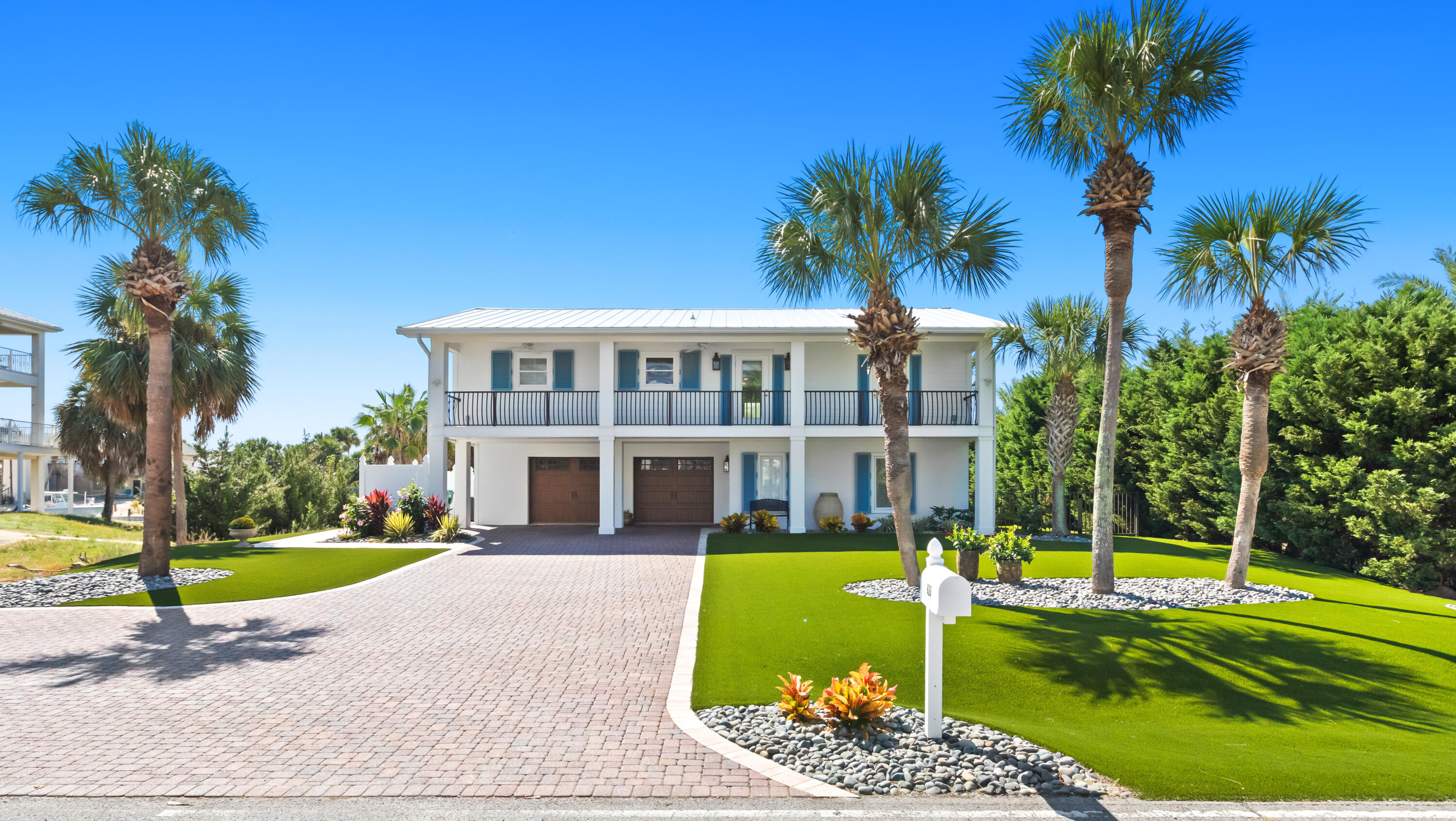 Located in the exclusive and highly sought-after community of Holiday Isle, 620 Lagoon Drive offers the ultimate coastal lifestyle. This beautifully maintained two-story home sits on a serene waterfront lot with immaculate landscaping and an oversized driveway, perfect for guests. The large two-car garage offers ample storage, a work area, and hurricane-resistant garage doors. Inside, the first floor offers a spacious bedroom with an ensuite bath and a walk-in closet. Upstairs, the heart of the home unfolds with an open-concept living, dining, and eat-in kitchen--perfect for gathering and entertaining. The kitchen has been recently renovated with modern finishes and high-end design, while the master bath has been reimagined as a spa-like retreat. Step outside to enjoy sweeping water views from the newly redone upper deck. The backyard has been completely transformed with a new pool, all-new upper and lower decking, fresh stonework, fencing, landscaping, and an outdoor grill. Boaters will appreciate the fully redone sea walls and pilons, along with all-new docks and three boat slips (two equipped with lifts) for effortless access to the water. Notable upgrades include new doors and sliders throughout, new exterior lighting, two new tankless water heaters, a whole-house water filtration system, a new roof, and new storm force shutters. Adding to its appeal, the property includes deeded beach access just a short .24-mile walk to the Gulf, making it easy to enjoy sugar-white sand and emerald waters whenever you please.
Holiday Isle is a private three-mile peninsula nestled between the Gulf of Mexico and Destin Harbor, celebrated for its pristine beaches, scenic walking and biking trails, and tranquil neighborhoods. Residents enjoy convenient access to dining, shopping, golf, fishing, and all the entertainment Destin has to offer while still living in a quiet, resort-style community.
Whether you're seeking a primary residence, second home, or investment property, 620 Lagoon is a rare opportunity to experience the best of Destin living. Schedule your private showing today and discover why Holiday Isle is one of Destin's most treasured communities.