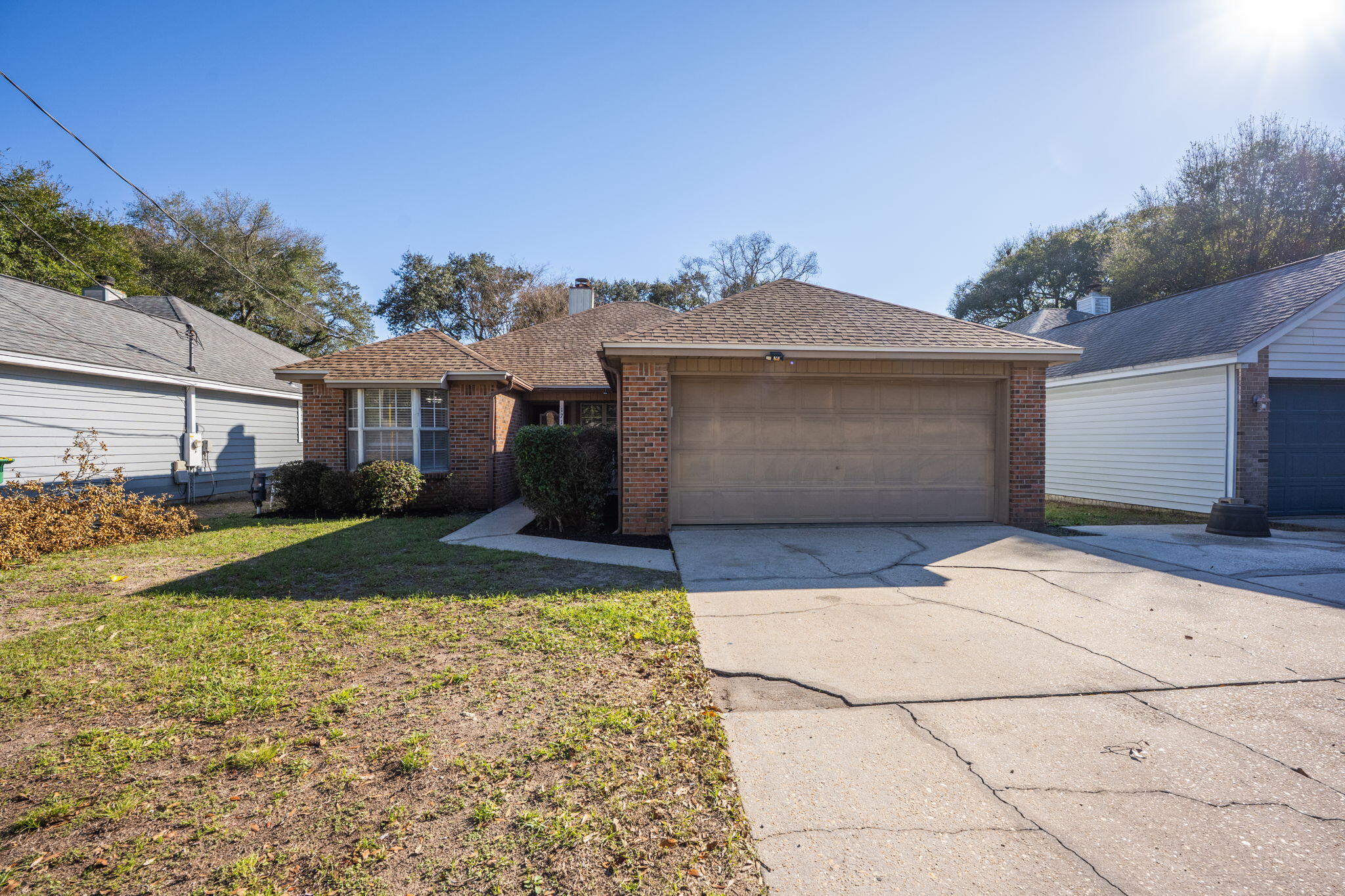 New 2024 Roof!! Welcome to 171 Richpien Rd, a delightful home located in the heart of Fort Walton Beach. This property is conveniently close to both Hurlburt Field and Eglin AFB for all Active duty and DOD personnel, FWB Medical Center, Choctawhatchee High School, and Pryor Middle School. For shopping and dining, you'll find the Emerald Place shopping center nearby, featuring stores like Michaels, TJ Maxx, and Publix, as well as the local eatery, The Neighborhood Cafe. Just a short walk away from the home is Kinfolks BBQ, a beloved local favorite for decades.Inside, the home boasts LVP flooring throughout and a cozy fireplace with a brick step. The bonus sunroom off the dining area offers additional living space. The kitchen is equipped with granite countertops, a mix of stainless steel and white appliances, a pantry, and a double counter height breakfast bar with plenty of counter space.
The primary bedroom features chair molding with shiplap, a double sink with a desk vanity, a standalone shower, and durable tile flooring in both bathrooms. Additional features include ceiling fans in all bedrooms and the living room, cordless blinds, a split bedroom floorplan, a security system, and a 2-car garage.