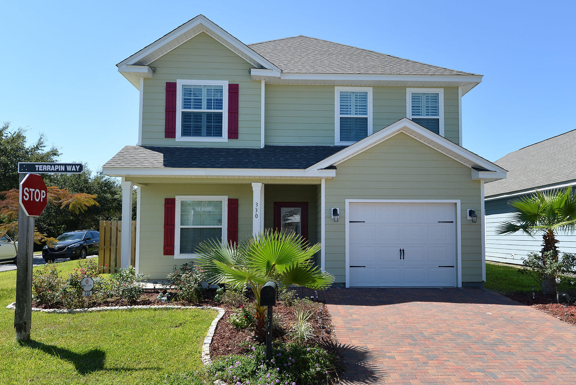 **LIKE NEW IN TURTLE COVE** This adorable 4BR/3.5BA home has been rarely used as a second home by the current owners so is in fantastic condition. The owners added many upgrades when they built the home including a beautiful tile back splash in the kitchen, amazing hardwood floors and gorgeous plantation shutters. They also upgraded the upstairs master bathroom from a standard tub to a roomy, pretty tile shower and added a large, screened-in patio overlooking the nice backyard. In addition to hardly being used, the owners have done a wonderful job maintaining the property, pressure washing and sealing the fence twice per year and pressure washing the house once per year. This home sits on a corner lot and has a nice-sized backyard.