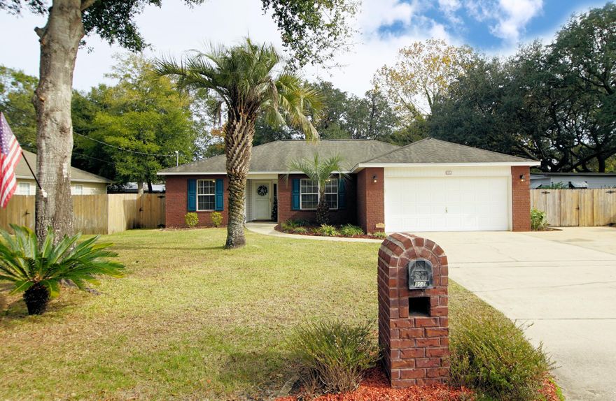 Welcome home to this beautiful four-bedroom, two bath home centrally located in Fort Walton Beach. The home has red brick front elevation and low maintenance light gray vinyl exterior. The open floor plan has approximately 1524 square feet with a split bedroom design. The entire home has been freshly painted in a light, neutral gray. The large living room, dining and kitchen has 10 foot ceilings with beautiful crown molding. The laundry room, hall bath, and kitchen have 20 x 20 porcelain tile. Solid surface counters top shaker-style cabinets with brushed nickel hardware. The high-top bar is perfect for a pair of bar stools for extra seating and continuing the conversation with guests while in the kitchen.