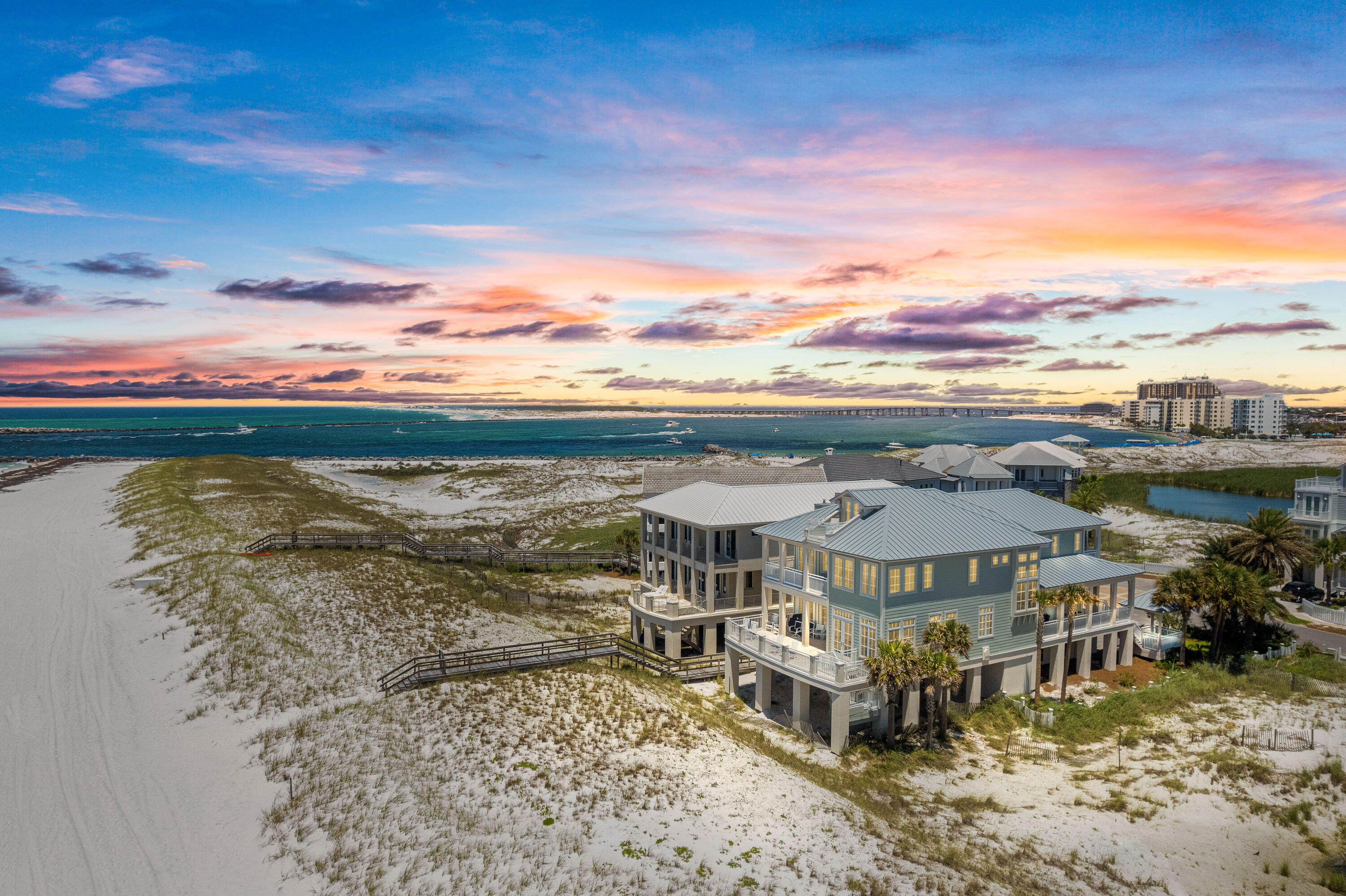 ''Footprints by the Sea''- Impeccably maintained and prominently positioned on the Gulf in Destin Pointe. It offers 70 feet of Gulf frontage sitting directly East of the East Jetty in Destin, with sweeping Gulf views in either direction. Destin Pointe is a gated community with 24/7 security that offers quiet/private beach access. It's a one owner home that was designed by a local architect. Golden Oak flooring throughout, Double car garage, large storage room for beach equipment, beautifully designed ''bump-out'' sitting areas overlooking the Gulf, Wood burning fireplace with mid 1800's Savannah Grey bricks, 2 Laundry rooms, large walk-in closets, wet bar, 3 oversized bedrooms, every bedroom has a double sink bathroom, surround sound stereo,