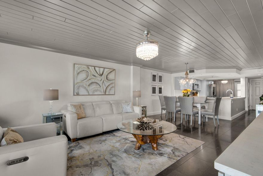 Recently renovated top floor unit with views of the Gulf, Beach and Harbor. Renovations started with cleaning of the air ducts and installing a Reme air purification system, tongue and groove ceilings in the living, dinning & bedrooms, crown molding throughout, fandilers, recessed lighting on dimmers in kitchen & wet bar, new cabinets, KitchenAid stainless steel appliances, motion sensor kitchen faucet, the kitchen footprint was expanded for extra storage, built in cabinets were added in the living room & home office, both bathrooms have marble flooring, the master bathroom has marble walls & zero entry for easy access, master closet has custom shelving, an additional closet for linens, two Tempurpedic adjustable bases make the king bed in master, Levolor remote blinds throughout, durable limestone flooring. The views are beautiful. In the morning watch the fishing boats catch their bait fish, later in the afternoon see the dolphins play and on Thursday nights in the summer enjoy spectacular fireworks from the balcony. Amenities include: tennis court, pickle ball courts, swimming pool, hot tub, sun deck, fitness room, separate women's and men's sauna, beach access, covered parking, boat parking, owners storage closet in the garage all included in this wonderful gated community.  Owner is a licensed real estate broker in Florida.