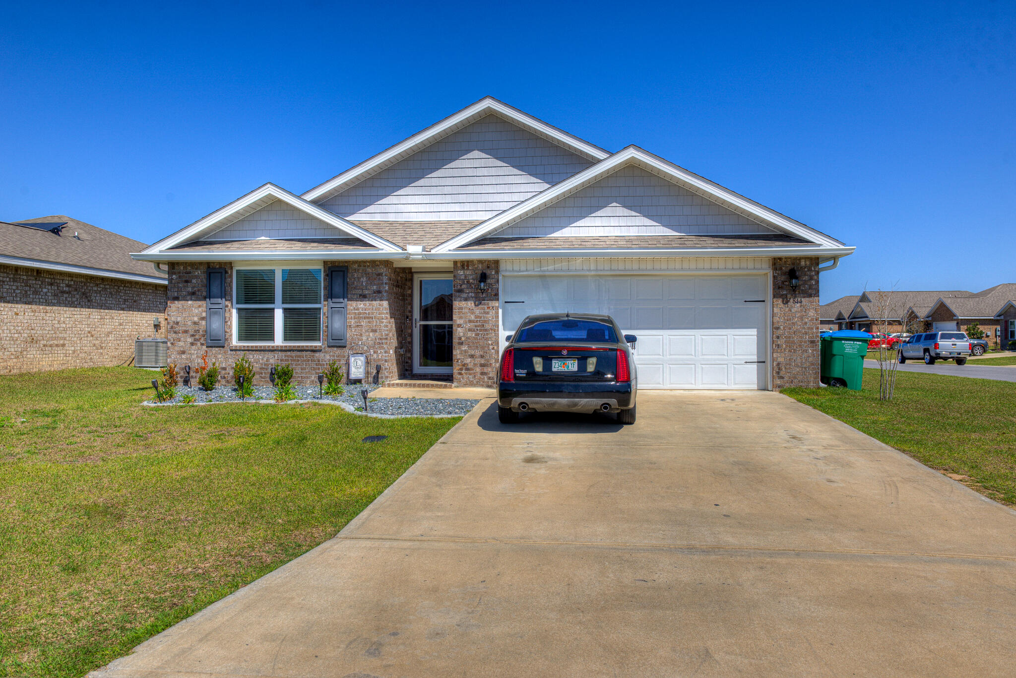 Beautiful home in the newly-developed Red Stone Commons neighborhood. This corner-lot family home has many bonus features like a SkyBell security system,  ceiling fans throughout, over-sized refrigerator and back splash in the kitchen, gutters all around,  privacy fence, storm door, window blinds, extended stone patio with beautiful landscaping. The Red Stone Commons community has a sparkling pool and summer kitchen area for its residents to take advantage of for BBQ's and parties all year round.