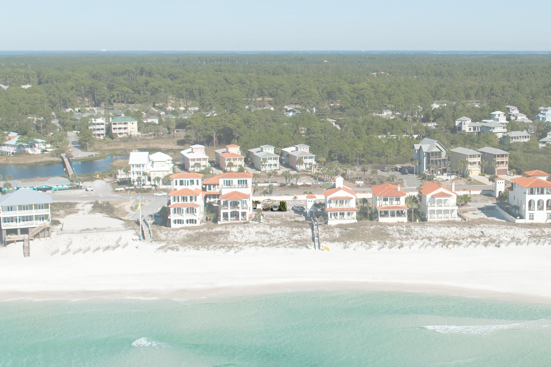 This lot south of Scenic Highway 30A is situated one row back from gulf front within the gated neighborhood of Vizcaya at Dune Allen. A mere 50 feet separates it from the steps of neighborhood beach access which invites you to enjoy a 1,000 foot stretch of white sand beach, reserved exclusively for owners and their guests. The dunes are protected by subterranean geo-tubes, hidden by natural vegetation, which are monitored and maintained annually. This lot with no build-out time requirement enjoys a direct gulf view corridor between the two gulf front properties located across the street. This rental-friendly neighborhood with pool surrounded by shade pavilions is known for its cohesive, Mediterranean-style, with white stucco exteriors and red barrel tile roofs.