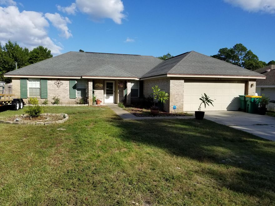 This is an all brick, lovely 4 bedroom, 2 bath home. The rooms have been newly painted. 3 of the bedrooms are wood floor and the 4th is carpet. New granite counter tops have been installed in the kitchen and in both bathrooms and the kitchen also has a new back splash. The living room has a fireplace for those who would like to have even more warmth in the winter. Lots of upgrades in this home custom aluminum hurricane shutters, whole house water purification system, above ground pool. A Must see!! Seller providing a $3,000.00 carpet allowance.