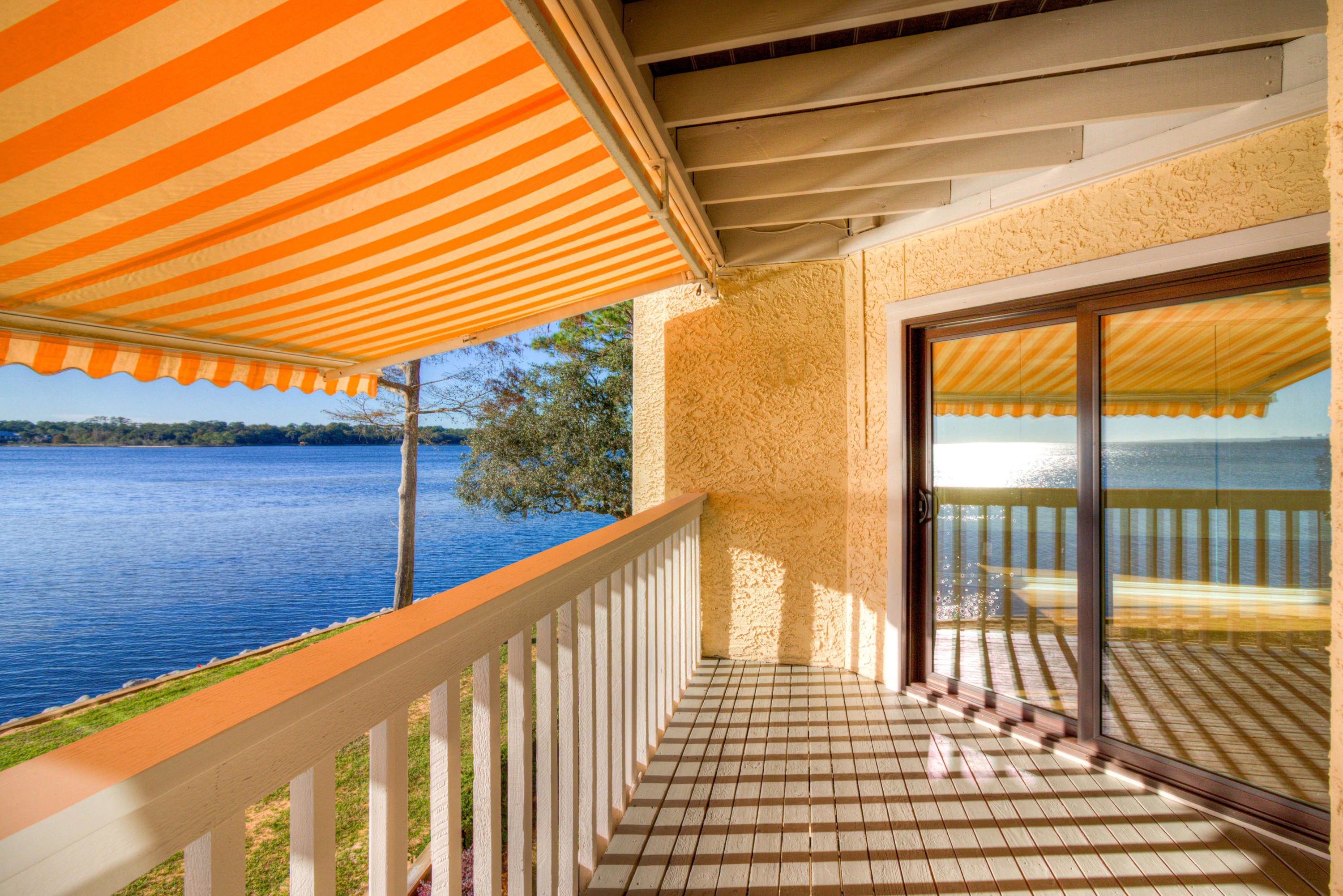 Waterfront Updated 2 Bed 2 Bath Condo with Expansive Bay Views!! Amazing Sunsets! Kitchen has Quartz countertops, Stainless Appliances, Soft close cabinets with custom inserts, Solid bamboo flooring, Floor to ceiling mirrors in living room. Master bath has double vanities and duel shower heads. Private Alarm System. New Hurricane rated sliding doors and windows with remote control solar blinds leading to a Large Balcony with auto retractable awning for shade when you need it. New Roof last year. Large capacity stackable washer / dryer included. Very close to the marina so you can watch the sailboat races from your new place. Furnace new 2015 and hot water tank new 2013