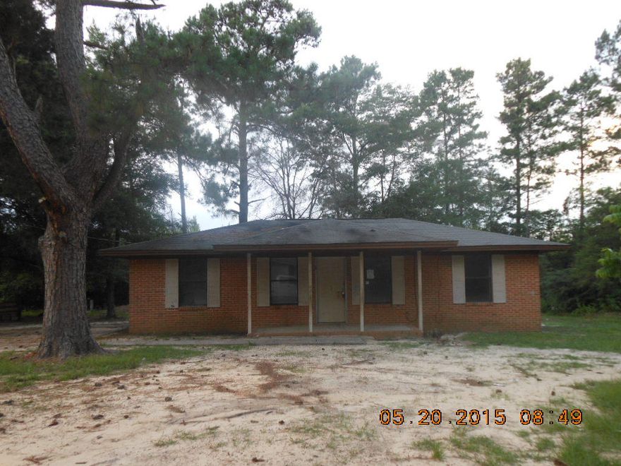 Brick home in country setting located in Ponce de Leon school district. Home fronts county maintained dirt road a short distance to pavement. Well and septic. Concrete pad for parking. Plenty of room to have a garden. Home needs TLC such as painting and floor covering. Central heat and air, sheetrock interior, split bedroom floor plan. Get this home at an affordable price. Call today!Bank of America associates/household members/HTS partners of bank, are prohibited from purchasing REO/auctioned properties directly/indirectly.