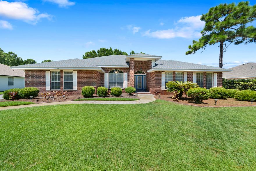 Welcome to your dream home in Driftwood Estates, where luxury and convenience meet. This 2,992 sq. ft. gem features 4 beds, 3 baths, and a 1/2-acre lot. Enjoy hardwood floors, vaulted ceilings, a fireplace, and granite countertops. The master suite includes dual walk-in closets and an elegant bath. The home boasts a new roof (2023), security system, and a fenced backyard with space for a private pool. New covered living space with remote control ceiling fans. Enjoy wooded serenity with private green space behind home. Driftwood Estates offers a playground, basketball and pickleball courts and more and is ideally located near the hospital, shopping, beach, public boat launch, and restaurants. Don't miss out on this blend of luxury and convenience!