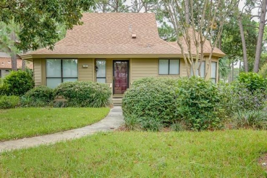 This charming single level home in Fairways offers lush tropical landscaping giving a sense of privacy, as well as the added advantage of a location on the 8th hole of The Links Golf Course. Showcasing serene Bay and lake views from the living room, master bedroom, sunroom, and large back deck, highlights include a hot tub on the back deck, two bedrooms and two full bathrooms, and an enclosed (heated and cooled) sunroom. The dining room is surrounded by windows on 3 sides allowing plenty of natural light into the space. The entry, kitchen, both bathrooms, and the sunroom offer tile for easy care and maintenance with the living, dining, and bedrooms offering the comfort of carpet. The guest bedroom includes a closet and en-suite bathroom complete with a large walk-in shower.