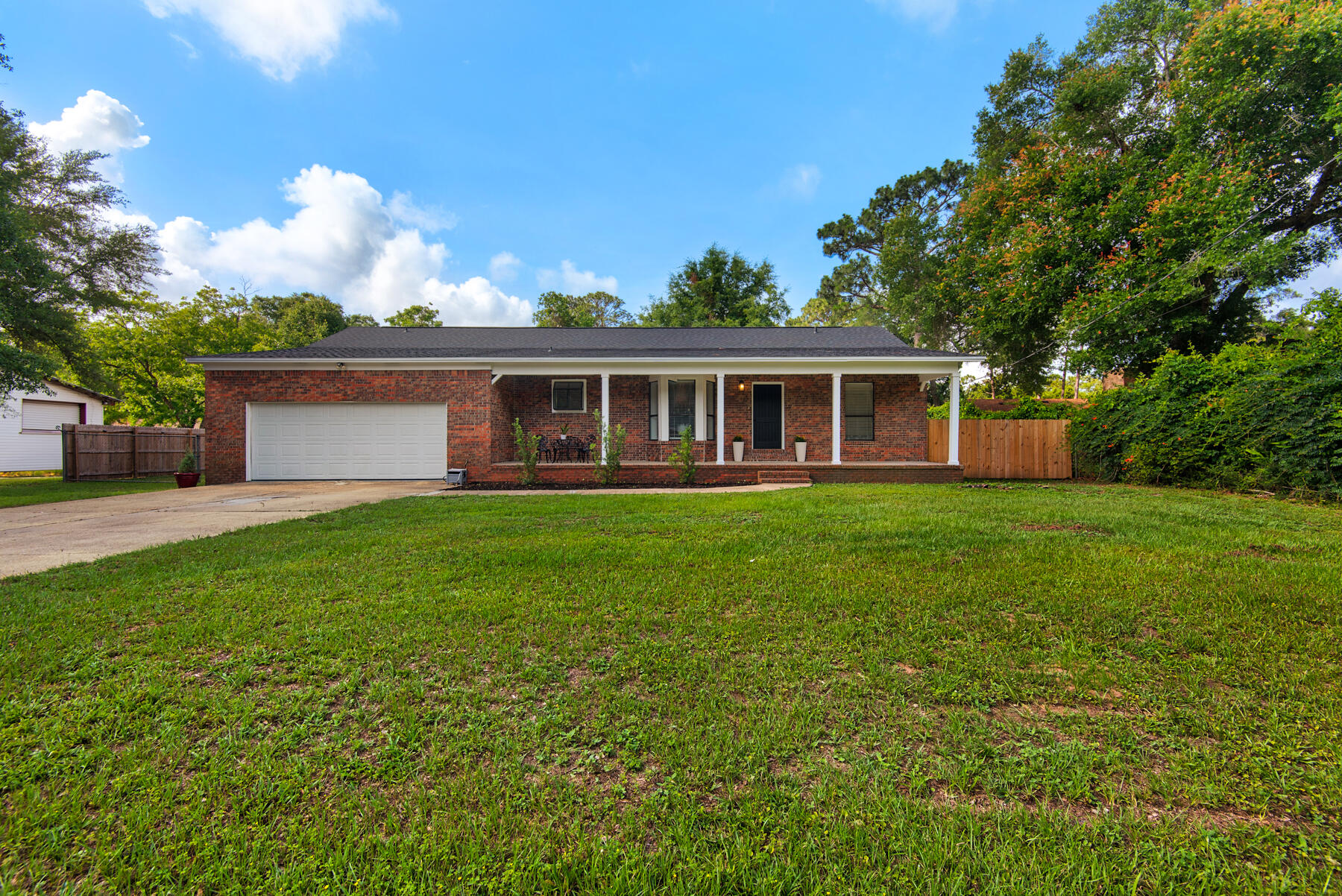 Welcome to 5699 Crestwood Dr - where classic charm meets modern updates! This spacious brick ranch-style home in the heart of Milton has been thoughtfully renovated throughout. Enjoy peace of mind with a brand new roof, new water heater, all-new plumbing, and fresh interior and exterior paint. Step inside to a bright and airy interior featuring stunning new LVP flooring, new interior doors, and a seamless open floor plan perfect for both relaxing and entertaining.The expansive living area boasts soaring vaulted ceilings with exposed beams, dual ceiling fans, and a cozy whitewashed brick fireplace - a perfect spot to gather with friends and family. The large kitchen is a chef's delight, showcasing new stainless steel appliances, updated countertops, a gleaming metal backsplash, and crisp white cabinetry. Whether you're hosting dinner parties or casual brunches, this kitchen will inspire your inner chef.
Retreat to the serene master suite featuring durable new LVP flooring, elegant fixtures, and a newly updated ensuite bathroom complete with dual vanities, a relaxing whirlpool tub, and a separate walk-in shower. Two additional bedrooms provide plenty of space for family or guests, while the second updated bathroom ensures comfort for all.
Step outside to your private oasis! The backyard is fully fenced with a new privacy fence, complemented by a brand new exterior deck perfect for grilling and outdoor gatherings. The spacious yard offers endless possibilities for gardening, play, or relaxing under the shade of mature trees.
Located in a quiet neighborhood yet minutes from shopping, dining, and top-rated schools, this home is the perfect blend of tranquility and convenience. Don't miss your chance to make 5699 Crestwood Dr your next home - schedule your showing today!