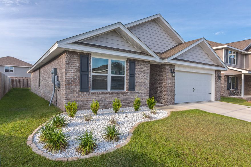 'The Cali' is a favorite with 4 beds/2 baths, covered back porch & 2 car garage. This open floor plan with a kitchen island, stainless appliances and granite countertops look out to the Dining &  Living Room. All the common areas feature vinyl plank flooring while the Bedrooms have comfy carpet. The Primary Bedroom/Bathroom is complete with two spacious closets, double vanity & separate toilet room. The 3 additional  spacious bedrooms and bathroom are located toward the front of the house. This is a ''smart home''. Camera doorbell, garage door opener, living room light, both back and front porch lights, thermostat & front door lock can be controlled through the alarm.com APP.  Low quarterly HOA fee offers many amenities to include zero entry pool, playground, clubhouse and dog park. Short commute to Eglin AFB & 7th Group Compound while the beach is only a 35 minute drive.