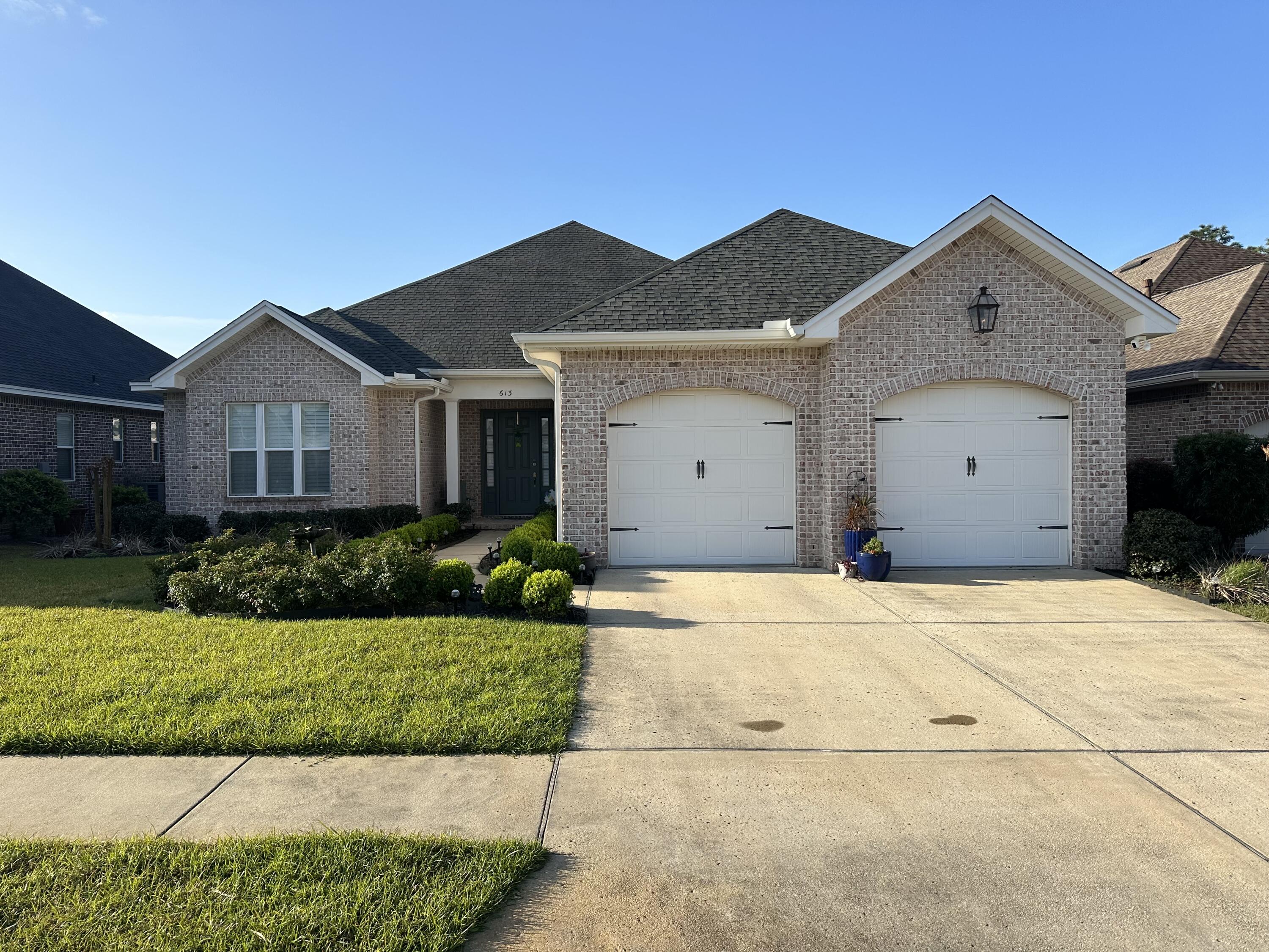 This meticulously crafted 4-bedroom, 3-bathroom home, built by a premier builder, is designed for both comfort and efficiency. The open concept floor plan creates an inviting atmosphere, featuring 8' doorways and wood LVP flooring that blends style with durability.You'll love the quartz countertops and Legacy cabinetry equipped with soft-close hinges and drawers. The kitchen shines with stainless steel appliances and double ovens, perfect for culinary enthusiasts. The private guest wing ensures visitors enjoy their own space, while the spacious master suite boasts a large shower and closet.Additional perks include a custom bricked storage building that matches the home, plantation shutters, a dedicated office nook, a whole-house water filter, and a central vacuum system.