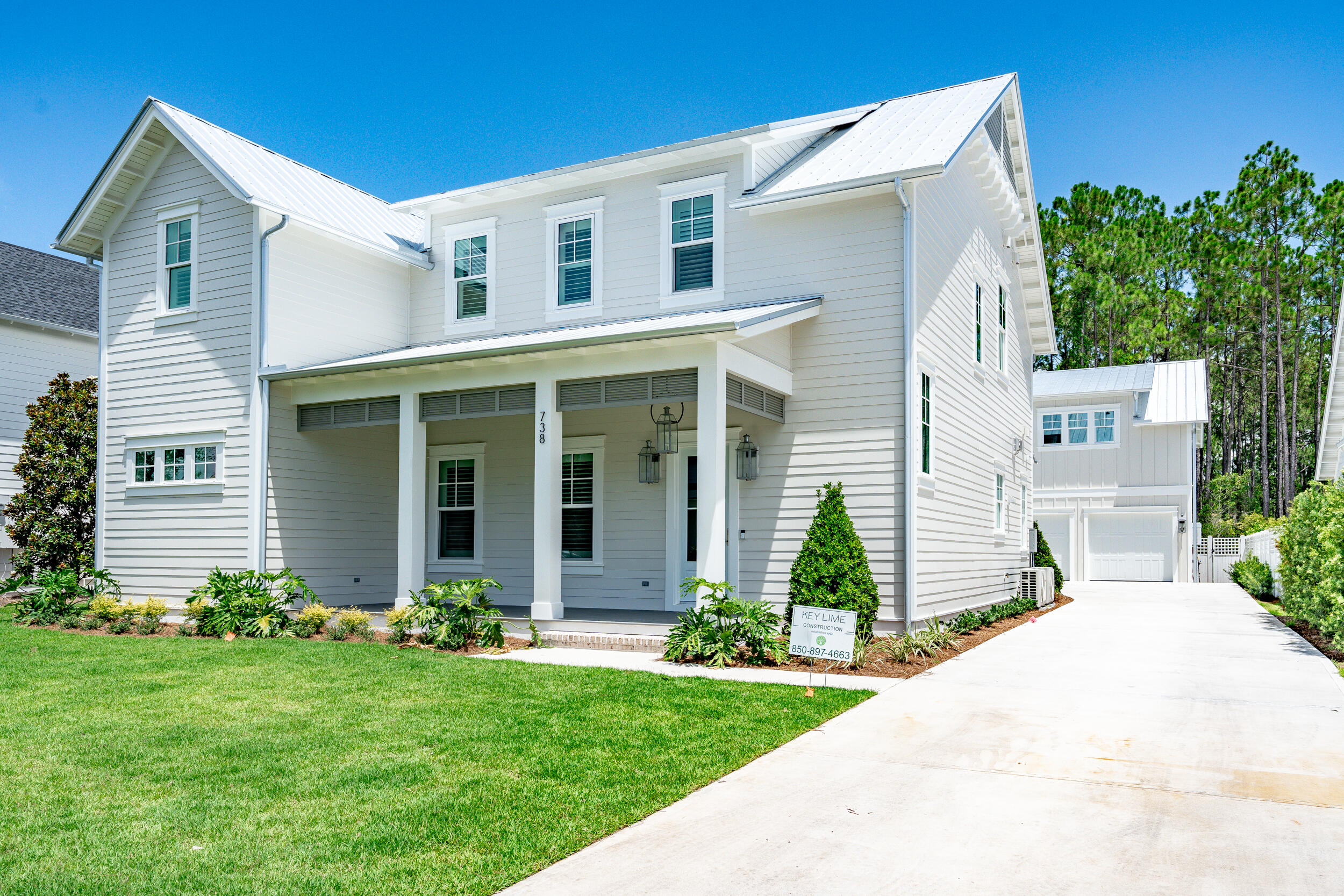 MOVE-IN READY and Gorgeous - Seller paying $20,000 in Buyer's closing costs! Introducing the Magnolia plan, a custom 5 bedroom, 5.5 bathroom plan (totals include carriage house) by Key Lime Construction located in the prestigious Greenway neighborhood of Watersound Origins. The 2-car detached garage has a carriage house suite above adding the fifth bedroom for extra space for family and friends to visit in luxury! This custom metal roof plan, presents 2 Owners' Suites! The 1st floor Owner's Suite is located directly off the large Foyer, leading to the spacious Great Room/Living Room that hosts a separate large Dining area directly off the Kitchen for easy access, a dry bar and a gas fireplace for delivering a cozy ambiance.