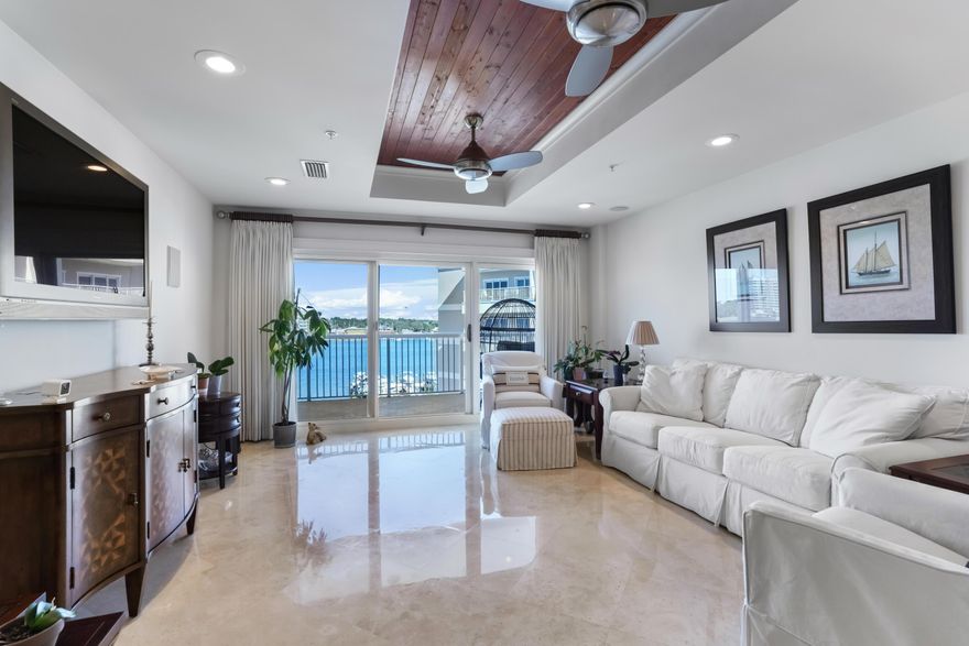 Welcome home to your meticulously maintained, Stunning 5th floor condo providing you with the finest lifestyle Destin has to offer including Beach & Boaters Paradise! Potential boat slip based on availability upon purchasing this condo at Sun King for your Boat! Hop on your vessel & you're Just 5 minutes to Crab Island & the Destin Pass, Gulf of Mexico & the Intercoastal with a plethora of fun to be had fishing & boating! The Beach is rather your thing? No Sweat, 2 private deeded beach accesses as well as 2 other public beach accesses are a very short distance away! Walk, Bike or take the golfcart to the beach easily! Not only are the views spectacular from this condo you can even watch the flight shows & fireworks right from your balcony! Prepare to be awestruck the moment you walk in the door of this unique condo encompassing so many unparalleled details. Custom cherry full height cabinets adorn the kitchen complementing the gorgeous marble countertops in this open kitchen with tons of storage. Perfectly flowing into the living room with views stretching across the beautiful harbor waters. You can't miss the elegant wood detail on the ceiling in the living room & master bedroom. Unique to this unit, the owner was grandfathered in with stunning tile on the balconies creating the seamless flow from inside to outside. Both master & guest bedrooms have superb water views & hurricane rated glass sliders welcoming you onto the spacious balcony. With Views facing South, West and North, this retreat presents you with the most Spectacular Scenes of Destin's East Pass & the Gulf of Mexico as well as the Harbor! So fun watching the dolphins right from your window or the boats come & go all day! Spend mornings sipping coffee on the large balcony as you watch all the fishing boats head out the pass for a day of angling in our famous plentiful waters & after a fun day in the sun at the beach, in the pool or on your own vessel come home to breathtaking sunsets in your private oasis, or out on the boat for a sunset cocktail cruise watching the picturesque sky display breathtaking colors over the emerald green waters this area is famous for. This rental restricted community is convenient to shopping, dining, entertainment, boating, fishing, kayaking, paddleboarding, all the things to enjoy your new beach life within a short walk or drive. You can even take your golfcart around Holiday Isle or across to nearby shopping & restaurants! Stroll down to your poolside and jump on the water taxi from the docks for a ride to Harborwalk Village or any other harbor front establishment, they even run late night to get you home safely after an evening of fun! Bonus: the clubhouse has an ice machine for you to conveniently fill up your coolers for the beach, pool, or boat! Seize this opportunity to own a small piece of Destin's Luxe Life & Begin Living your Dream, Making Memories Now! 