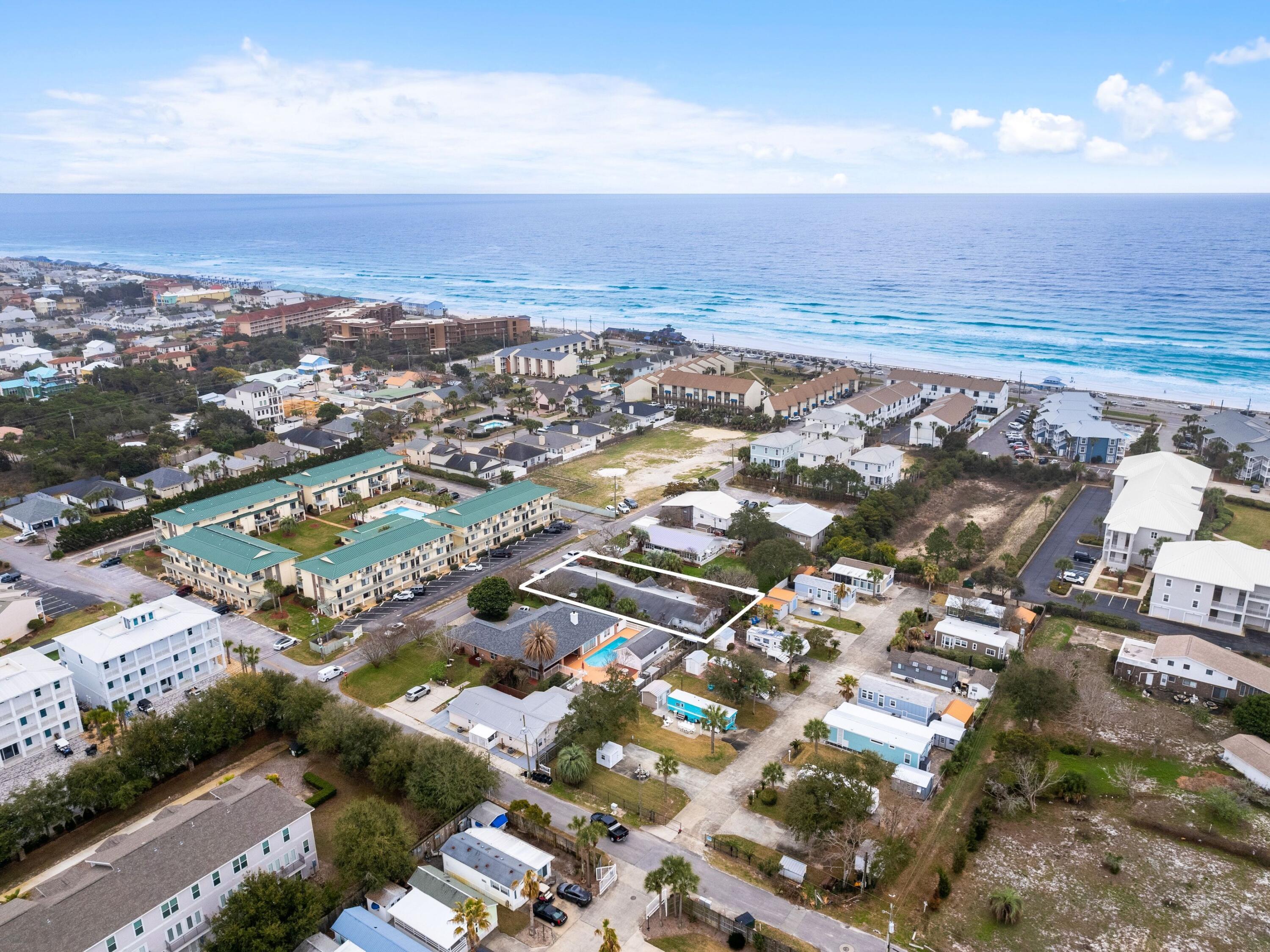 Welcome to a rare opportunity to own the perfect lot in Miramar Beach! This prime piece of real estate is just four minutes away from a beautiful white sandy beach and crystal clear waters, allowing you to enjoy the natural wonders of life every day. This incredible beach lot provides an opportunity to build a truly special home or even a rental property. The local community has plenty to offer, such as fresh seafood restaurants, local markets filled with goods, public beach access to unwind and take in a sunset. Currently there are 5 rental units in place (Four 2 bedroom and One 1 bedroom) with tenants on a month to month basis. May qualify to be granfathered as current use. Don't miss this chance - come see how this lot fits into your plans to build today!