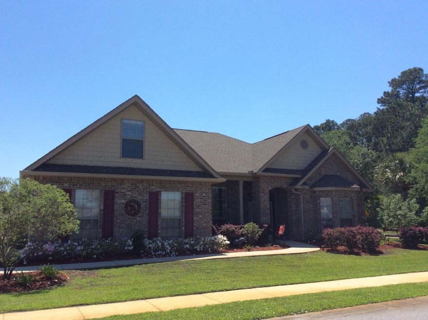 Featured is this beautiful home in the Whispering Lake neighborhood which surrounds a tranquil fresh-water lake with dock access and perfect for fishing. Inside you will find soaring tray ceilings, lovely architectural angles, with multiple UPGRADES. This home features 4 bedrooms/office with a bay window, 2 bathrooms,dining room, sun room, large family room and a upstairs bonus room. There's a spacious open kitchen with granite countertops, above and under-counter lighting, breakfast bar, and beautiful recessed panel cabinets with crown molding. Outdoor features include a patio with pull-down shades, a large fenced in backyard with detached utility building. Easy access to shopping and minutes from the beautiful white sandy beaches.