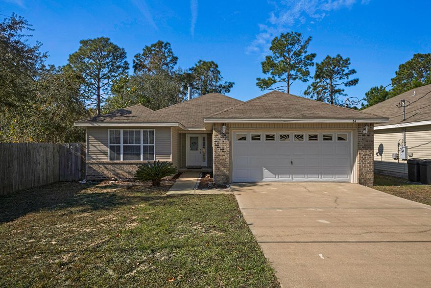 Recently refreshed. Open Floor Plan. This 3 bedroom 2 bath home is a delight. Minutes to Destin and all the amenities not to forget the worlds most beautiful beaches via the Mid-Bay Bridge connector. Kitchen is well equipped with granite counter tops, recently painted cabinets, under mount sink, and brand new Stainless Steel appliances. Breakfast bar opens into the Family room with vaulted ceilings and wood burning fireplace. The master bedroom is located in the back of the house with trey ceilings, walk-in-closet and adjacent large master bath featuring double vanities and tub/shower combo. All bedrooms are generous in size with plenty of closet space. Brand new carpet throughout home with tile in kitchen/dining and baths. New paint. The exterior features include open covered patio with