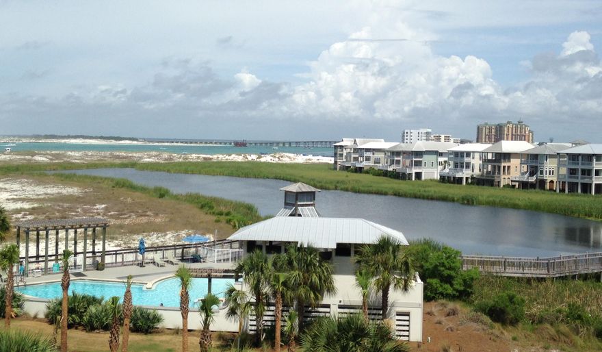 Wonderful View of East Pass, the Destin Bridge and Harbor and the Gulf of Mexico from this sought-after location. The ''10'' section of the Jetty Side affords the best views on the west end. This unit is nicely updated with new interior doors and bamboo flooring. New interior photos will be loaded soon.