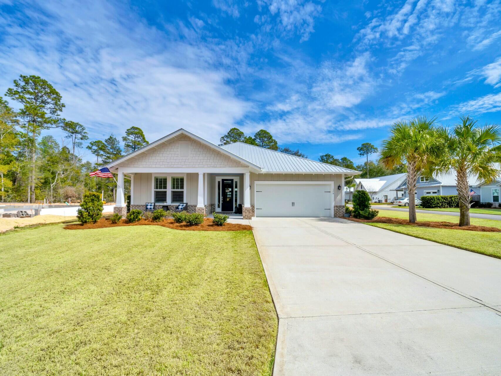 Welcome Home to 176 Hibernate Way in S. Freeport's coveted Bear Creek community! This gated resort-style neighborhood is just a short drive over the 331 Bay bridge to the stunning beaches and everything 30A has to offer. Bear Creek is home to beautiful Coastal Craftsman-style homes, spacious homesites, and an inviting, friendly atmosphere that makes it the perfect place to call home. This home sits on a manicured coveted corner lot across from a beautiful pond.This 2020 custom-built residence is a perfect blend of quality, serenity and functionality. Built by the local and respected, Coastal Builders of Northwest Florida, it features a thoughtfully designed floor plan with 3 bedrooms and 2 bathrooms. It's a perfect fit for one-story living. Every detail has been carefully considered to provide both comfort and style.
Step outside and enjoy the stunning outdoor spaces, including a wide front porch with views of a serene pond. The 14-foot screened-in back porch overlooks a beautifully manicured and professionally landscaped backyard, perfect for relaxation and/or entertaining guests. The backyard is completely enclosed with a board-on-board cypress fence. It's offers ample outdoor living spaces with the oversized 17 x 19 paver patio overlooking the neatly manicured Zoysia lawn, kept lush by an well-fed irrigation system.
Inside, you'll find an open-concept floor plan with 9-foot ceilings, 8-foot doors, and elegant tray ceilings with recessed lighting in both the living room and primary bedroom. The coastal trim package and smooth-finish walls throughout the home enhances the sense of sophistication.
The open and airy kitchen is a highlight, featuring white shaker cabinets, stainless appliances, quartz countertops and handmade tiled backsplash grants a clean, seamless look. The kitchen island with seating is perfect for entertaining. The entire space flows effortlessly into the living and dining areas. Plantation shutters and top-down-bottom-up blinds add a touch of style and privacy.
The primary suite and spa-like ensuite are spacious, light, bright, stylish and truly functional. There is built-in shelving in the closet, a tray ceiling, and easy access to the back porch. The ensuite offers an oversized walk-in shower, his and hers vanities with loads of counter space - even a make-up counter, and water closet.
Storage is not lost on this home. There is built-in shelving in the garage, additional attic storage above the garage, a separate laundry room just inside from the garage and a coat closet near the front door.
Enjoy the peace of mind that comes with quality construction, including impact-rated windows and doors, a metal roof, spray foam insulation in the attic for energy efficiency, and concrete Hardie siding. Gutters and downspouts have been installed, along with a security system to keep you and your loved ones safe.
Bear Creek offers fantastic amenities, including a swimming pool, tennis courts, pickle-ball courts, a basketball court, a fitness center, and a clubhouse, with even more to come in Phase 2. The community is just minutes away from Grady Brown Park, which features a beach, boat launch, playground, and picnic areas. And, of course, you're only a short drive away from the iconic beaches of South Walton, as well as world-class dining, shopping, and entertainment along scenic 30A.
This incredible one story home, exceptional location, and desirable community make it an opportunity you won't want to miss!
*All listing information is deemed accurate, but buyers should verify all pertinent details as needed.*
