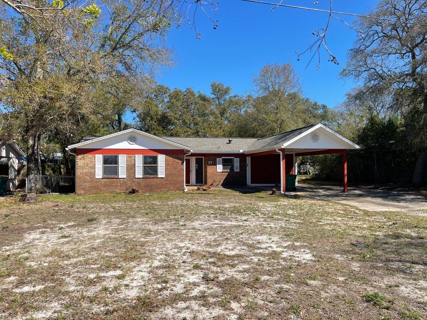 This delightful 4 bedroom  home features a primary bedroom with a spacious walk-in closet and a luxurious stand-up shower with an updated vanity, ensuring both comfort and style. Not only does the primary bedroom boast these wonderful amenities, but the entire home is adorned with tile and LVP flooring, eliminating the hassle of dealing with carpeted areas.Adding to the allure of this property is the newly installed roof in 2025, providing you with both comfort and peace of mind knowing that your new home is equipped with a sturdy and durable roof. Outside, you will find a sizable carport.  But that's not all - this home offers even more with a Florida room where you can unwind and enjoy the beautiful Florida weather and a large workshop that can serve as additional storage space or hobbies