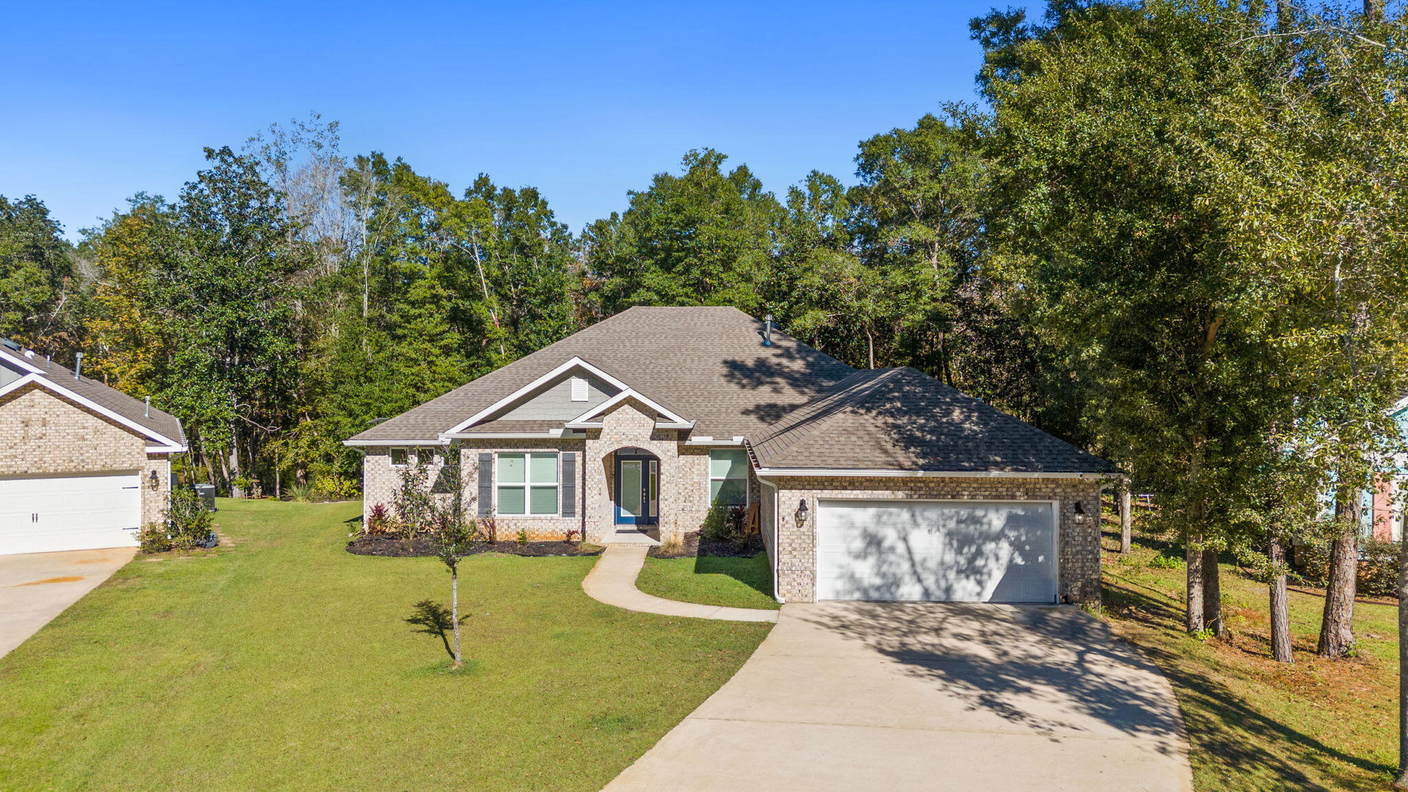 Stunning Hammock Bay all brick, single-story 2906 SF home with 4 beds, 3 baths, office, and flex room sits on .58 acre private cul de sac lot with a 4' extended garage! Featuring 10' ceilings, a spacious open-concept layout, and elegant design elements like shiplap accents, crown molding and custom built-ins, this home exudes style and comfort.  The gourmet kitchen includes quartz countertops, stainless steel appliances, and a butler's pantry. Primary suite offers a tranquil retreat with a shiplap fireplace, trey ceiling, dual vanities, and custom walk-in closets.  Outdoors, enjoy a huge brick-paver patio with built-in grill, spa-like hot tub, long driveway and backyard backing to nature preserve and creek. Hammock Bay has two clubhouses, three pools, Windmills Town Center, Props Brewery, 24/7 fitness center, pickle ball, basketball, 60 acre sports complex, open air fitness area, miles of sidewalks, amphitheatre, events coordinator, and well, too much to list! Come see you new home at 113 Sonata Street!  Buyer to verify all information and dimensions important to them.  