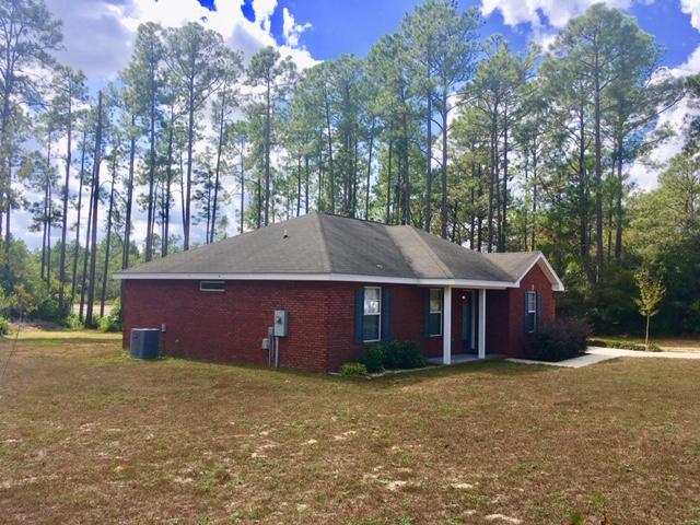 COZY WATERFRONT BRICK RANCHER -- Located on a full acre lot, this is a Ronny Jones built home, so you know the quality is there! 3BR, 2BA, with split floor plan. Would make a great starter home for a couple, young family, or retirees who want a low-maintenance property close to town in a nice neighborhood. 185 feet of waterfront frontage on Lake Rosemary. All electric home has granite countertops, black appliances, disposal, smooth-top range and a pantry in the kitchen. Laminate & ceramic tile flooring throughout the house. Huge walk-in closet in Master Bedroom. Tub/shower combos in both bathrooms. Oversize utility room with wire shelving and lots of storage. 0ne car garage with attic stairs and freshly epoxied floor. Wood deck plus one yard building are included. Won't last long!