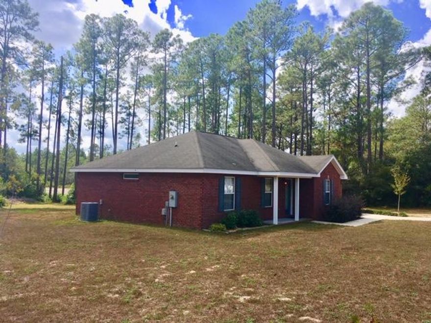 COZY WATERFRONT BRICK RANCHER -- Located on a full acre lot, this is a Ronny Jones built home, so you know the quality is there! 3BR, 2BA, with split floor plan. Would make a great starter home for a couple, young family, or retirees who want a low-maintenance property close to town in a nice neighborhood. 185 feet of waterfront frontage on Lake Rosemary. All electric home has granite countertops, black appliances, disposal, smooth-top range and a pantry in the kitchen. Laminate & ceramic tile flooring throughout the house. Huge walk-in closet in Master Bedroom. Tub/shower combos in both bathrooms. Oversize utility room with wire shelving and lots of storage. 0ne car garage with attic stairs and freshly epoxied floor. Wood deck plus one yard building are included. Won't last long!