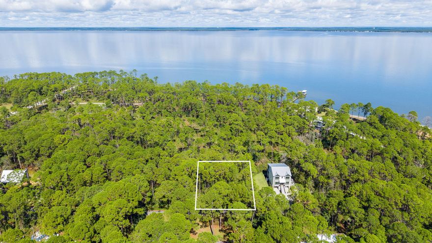 This .67-acre homesite combined of two lots on Crissman Road in Santa Rosa Beach offers a rare combination of privacy, space, and access to the best of coastal living the area has to offer. Located north of Highway 98 and just a block from the Choctawhatchee Bay, the property sits in a quiet, natural setting with mature trees and no HOA, giving you complete freedom to design and build your dream home. The bay is only moments away, with a nearby public boat launch that makes it effortless to enjoy boating, paddleboarding, fishing, or sunset cruising. Cessna Landing County Park is only 1.5 miles from the property and features a boat launch, docks, picnic shelters, a playground, basketball court, and squash court, creating an ideal spot for year-round outdoor recreation. While the setting feels peaceful and removed, the lot is less than ten minutes from the Ed Walline Regional Beach Access and Gulf Place Town Center, where you will find favorite local restaurants, shopping, and entertainment. With the sugar-white sand and emerald waters of South Walton's beaches so close, along with strong nearby sales and custom homes in the surrounding area, this property presents an exceptional opportunity to build in one of Santa Rosa Beach's most desirable north-of-98 locations.
