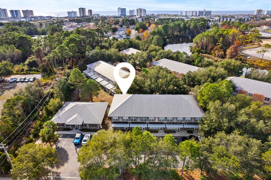 Rare and sought after live/work opportunity in the heart of Destin. Enjoy a first level commercial end-unit currently configured as office space coupled with a one-bedroom residential unit above featuring a full kitchen, living area, and seperate dedicated access.  Located just north of Highway 98 on Airport Road, the location is strategically positioned within close proximity to Destin Executive Airport along with ample retail, dining, and commerce venues. The first-floor commercial unit is generously sized encompassing an open flex area, private office, kitchenette, and bathroom creating a blank canvas for a multitude of uses including professional services, legal office, real estate office, and much more. 986 Airport Road is a truly compelling configuration for owner-operators and investors alike- inquire today to learn more. 