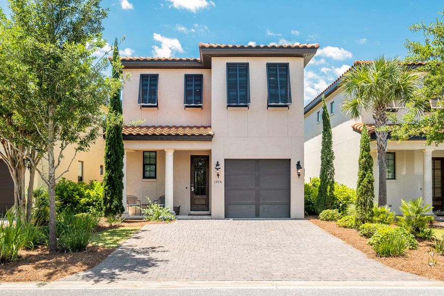 This completely turn-key, two-story home is tastefully decorated and well appointed. Peacefully situated on the lagoon in Villa Lago, the serene view of the water features and lily pads can be enjoyed from your private covered patio while you're entertaining during a summer cookout or just enjoying the evening air. This excellent open floor plan offers the convenience of a full bedroom and bathroom on the first floor, leading into the kitchen where you'll find a fresh look with white countertops and white cabinets, and flows into the living room and dining area that allows access to the back patio. Take a dip in the refreshing community pool, or up to 10 people can hop on the two included golf carts that are parked in the attached garage and cruise just about a mile down to the Gulf, joyride past the multiple world-famous golf courses, or take a five minute ride to the shops and restaurants in The Village of Baytowne Wharf, where many of the most popular local wine and food festivals are held. This house is perfect for anyone who prefers proximity to grocery shopping, retail shopping, dining, and stunning beaches to be less than 5 miles.