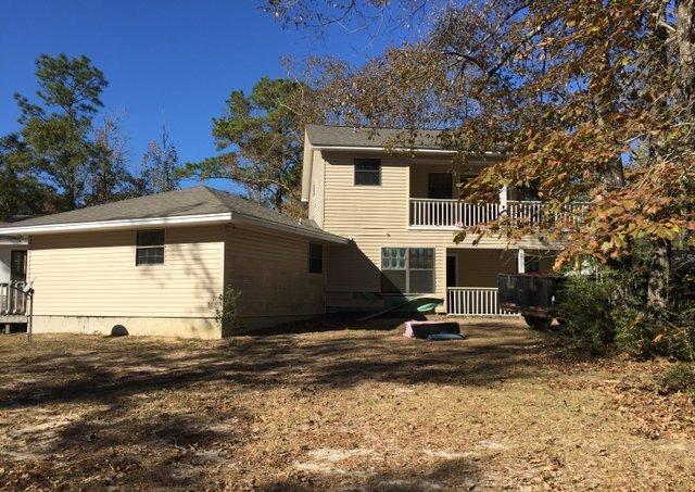 REO ~ Quiet Country Living on over 9 acres! This 4 Bd / 2 Ba home is situated almost 400 ft off the road offering plenty of privacy. The interior of the home offers parquet floors through out except the kitchen & baths. You'll enjoy the scenery from both the front balcony or large back deck. There is also a large Florida Room overlooking the deck & back yard. The home has brand new roof! This property is eligible under the Freddie Mac First Look Initiative Through December 20, 2016.