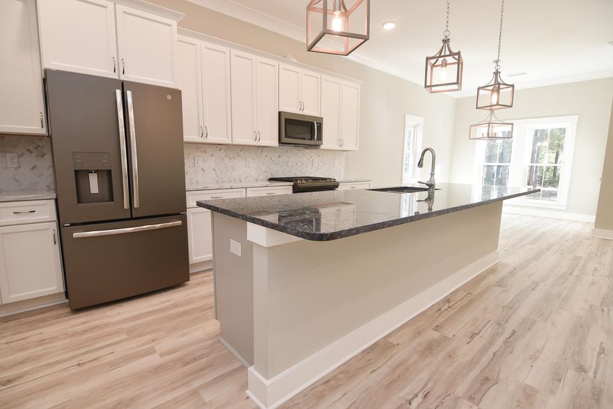 Welcome home to this 5 bedroom and 3 full bathroom new construction property. In the craftsman style, this home offers all the comforts and conveniences of modern living: solid surface flooring, QUARTZ/GRANITE counter-tops; custom, SOFT-CLOSE, shaker style, all-wood cabinets; SLATE finished GE appliances including a gas stove; tankless hot water heater, large walk-in pantry, and large central island w/ breakfast bar. This custom home also includes: 9-11' ceilings, CROWN, tray ceiling, and arched walk-thrus. Note: Pictures are of a home by the same builder with similar finishes & floor plan. Some details depicted may not be the same.