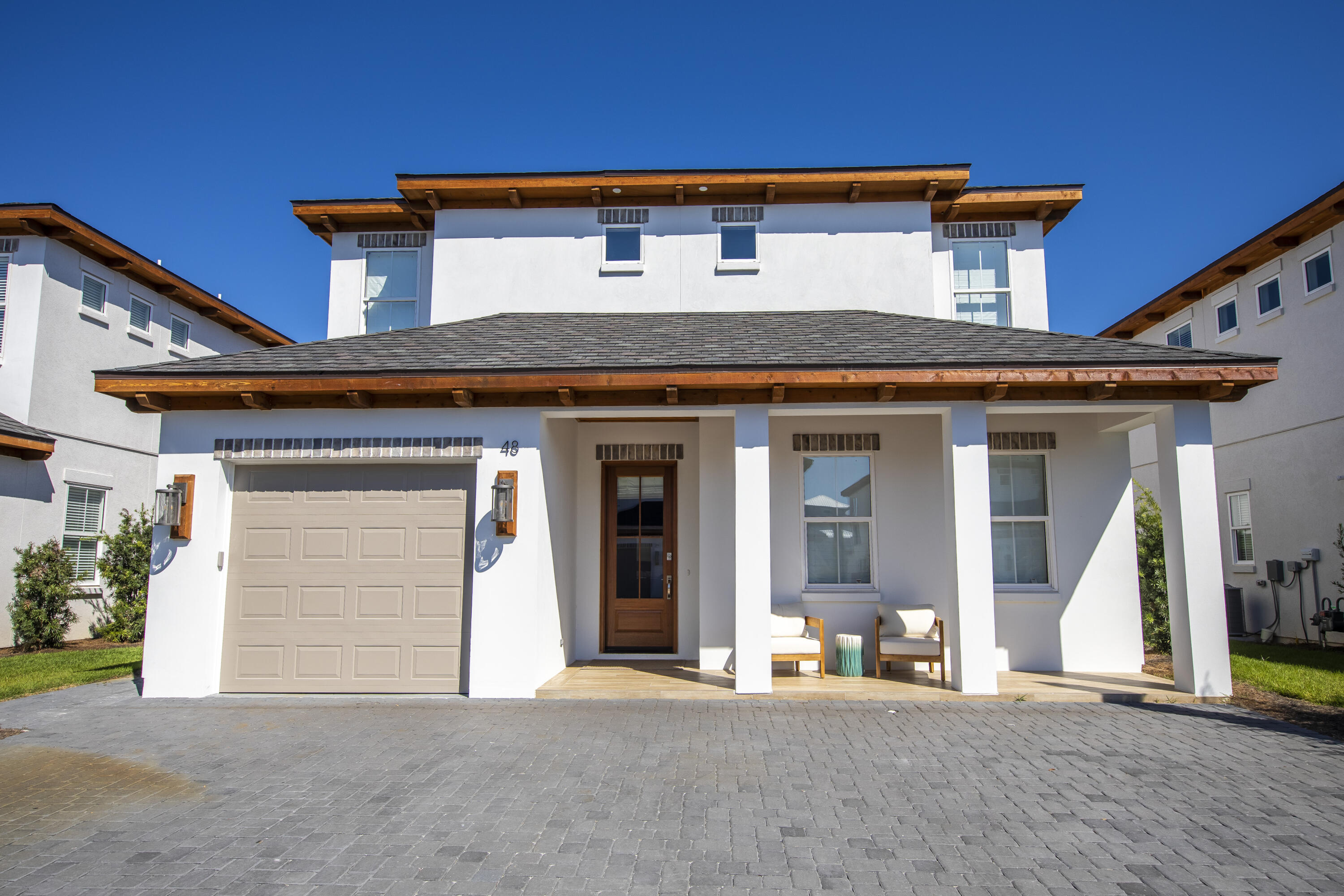 New construction, beautifully furnished and turn key 4 bed 4.5 bath home walking distance to Gulf Place. This home features a ton of upgrades-tankless water heater, stainless steel appliances throughout, shiplap walls, 2 master bedrooms, covered patio, custom built-in bunks, standing soaker tub, first and second floor living space and private pool. This home sits on a quiet, private street with a 1 car garage and 3 additional spaces in the driveway.Gulf Place features shops, restaurants, and public beach access. This home is also within a mile of the Santa Rosa Golf and Beach Club.