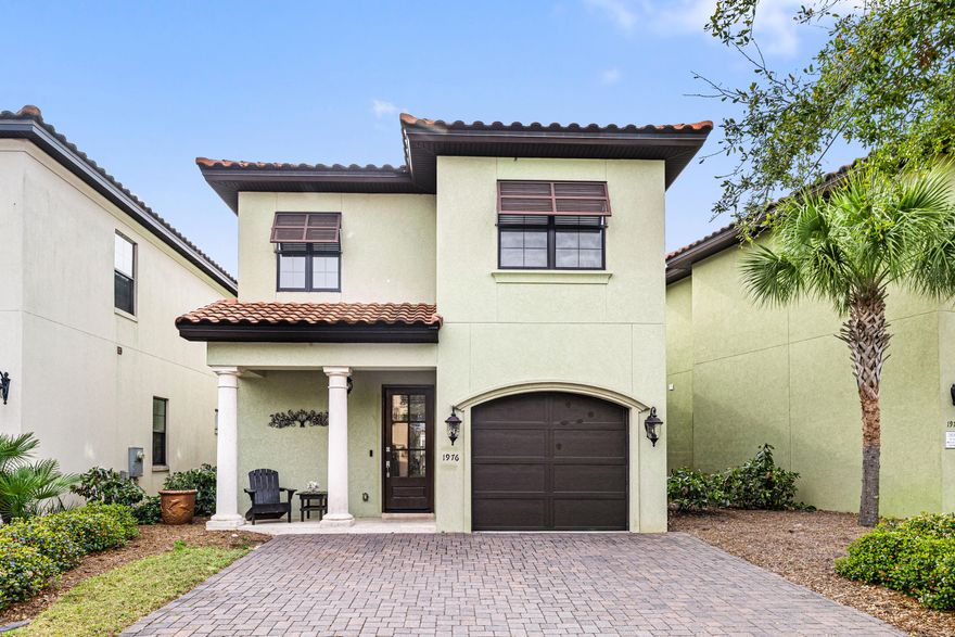 Experience Sandestin in this 3BR, 3.5 BA Mediterranean-inspired home, thoughtfully designed with an expansive open-concept kitchen, dining, and living area that invites you to entertain and unwind. The rich wood plank ceramic tile flooring and soaring ceilings adorned with crown molding create a sophisticated ambiance, while a convenient powder room adds a touch of practicality to the first floor. The kitchen features cabinetry topped with granite countertops, stainless steel appliances, and range hood. The large walk-in pantry ensures ample storage space, and the generous breakfast bar is perfect for morning coffee or casual meals.Upstairs, you will find the primary suite awaits--a tranquil retreat featuring a spacious sitting area ideal for a private office or reading nook, an impressive walk-in closet, and a luxurious ensuite bathroom. Melt away stress in the oversized shower or soak in the separate tub, complete with dual vanities for ultimate convenience. Two additional guest suites offer the comfort of their own ensuite bath, providing privacy and relaxation for family and visitors alike.
Bring the indoors out on the inviting, covered back patio, where you can savor serene water views or fire up the grill for unforgettable evenings and breathtaking sunsets.

Additional features include a spacious one-car garage--perfect for your vehicle, golf cart, or storing beach essentials. As a Villa Lago owner, you'll enjoy exclusive access to the vibrant community clubhouse and sparkling pool, creating a genuine resort-style atmosphere. A golf cart is included with the home, offering effortless access to everything the resort has to offer, including white sand beaches, four championship golf courses, tennis and pickleball courts, fitness centers, the marina, and Grand Boulevard's premier dining, entertainment, and shopping venues. Whether you're seeking a vacation getaway, a primary residence, or an investment property, Villa Lago delivers versatility and luxury for every lifestyle.