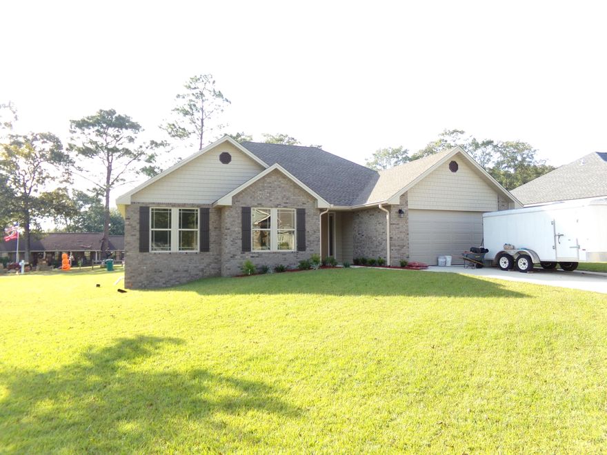 Just minutes from shopping & schools~  This house is a one of a kind~  Wide base board and 9 foot ceiling through out~  The foyer has coffered ceiling~  This 3 bedroom, split floor plan also has a Bonus room~  The living room has an electric fireplace  and has door opening onto the back patio~  The kitchen has plenty of  wood cabinets with plenty of counter space and a barn sink in the island that faces the living room~ It has stainless steel range, dish washer and range hood and granite counter tops~  Living room, kitchen have recessed lighting~  The master bath has a separate shower as well as tub and a large walk in closet~  This house screams quality~